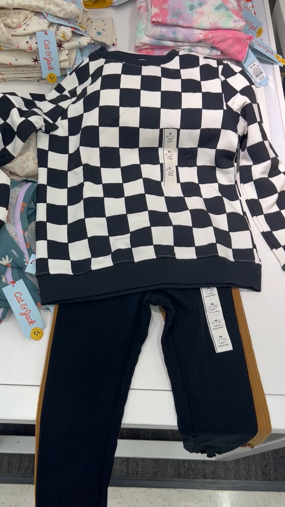 Okay the photo for the blue leggings is apparently this sweater so just click on it. And then these leggings were no where to be found online so sorry! 