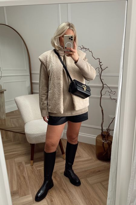 Styling leather shorts for autumn. Shorts & boots from Phase Eight, cashmere beige knit jumper from arket, the cutest shearling gilet & my coach crossbody bag

#LTKstyletip #LTKSeasonal #LTKeurope