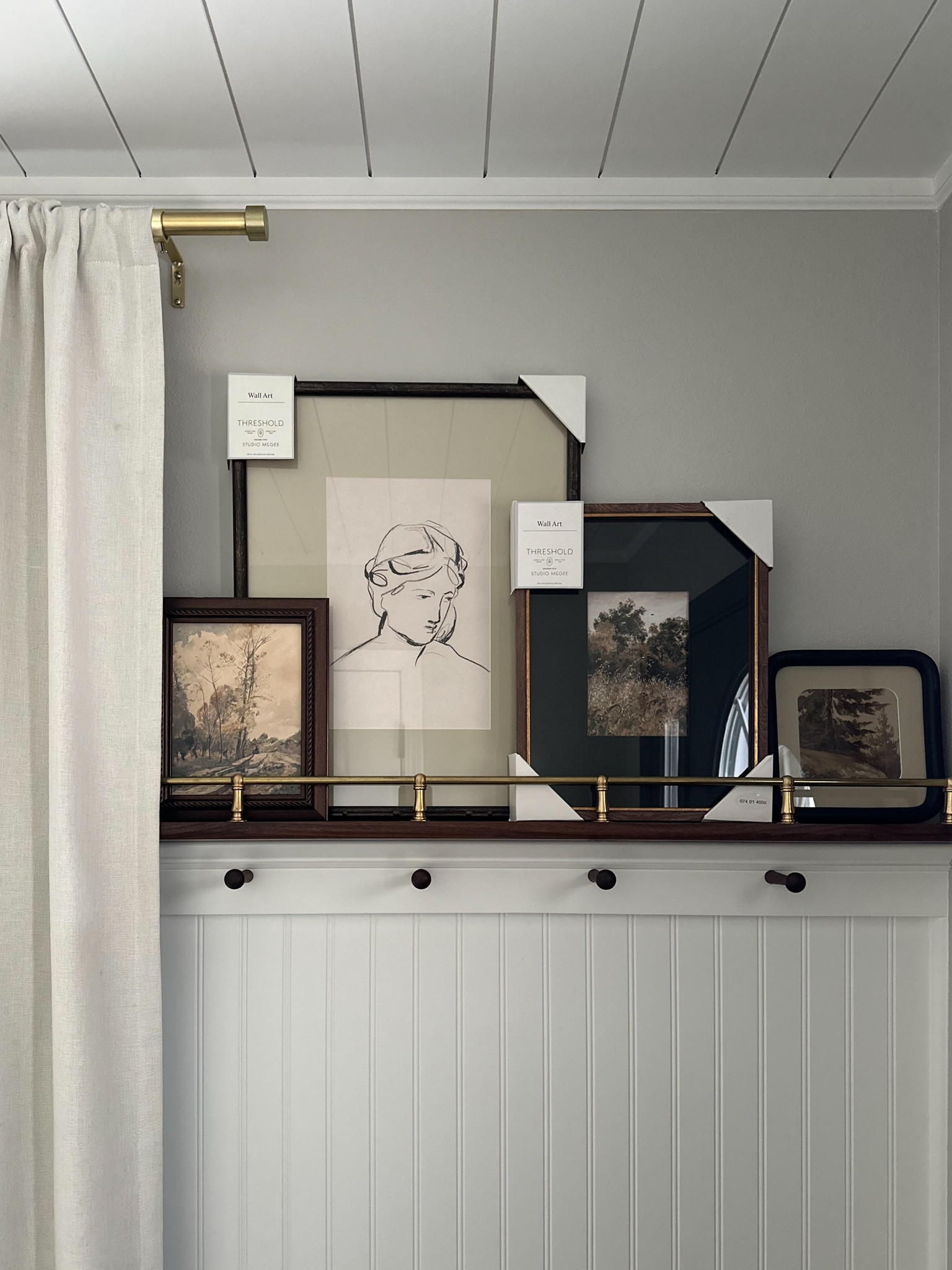 Picture ledge with brass railing in our entryway! 

#LTKStyleTip #LTKHome