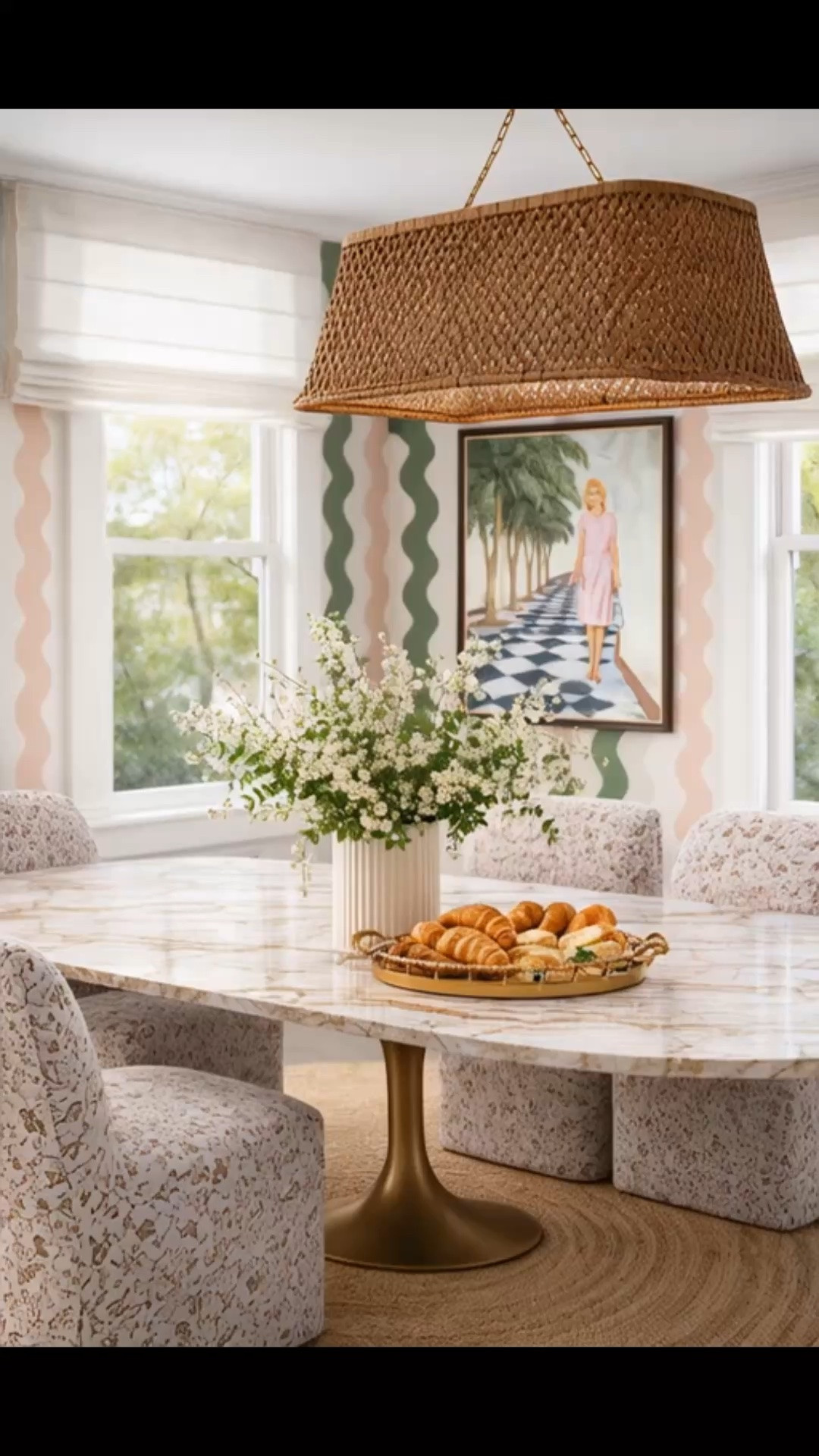 A dining room that feels timeless, playful, and effortlessly collected. I love how the wavy geometric wallpaper brings movement and a fresh pop of color, while the woven rattan chandelier grounds the space with warmth and texture. Paired with the marble dining table, upholstered dining chairs, and statement artwork, it creates a look that's both elevated and inviting.

The 4th of July Sales are here, and almost everything in this room is on sale—if you've been planning a dining room refresh, now is the perfect time.

#LTKSale #4thOfJulySale #DiningRoom #DiningTable #DiningChairs #Wallpaper #RattanChandelier #PendantLighting #Artwork #HomeDecor #InteriorDesign #ModernClassic #CoastalStyle #Tablescape #HomeInspiration

#LTKdayinmylife #LTKHome #LTKSaleAlert