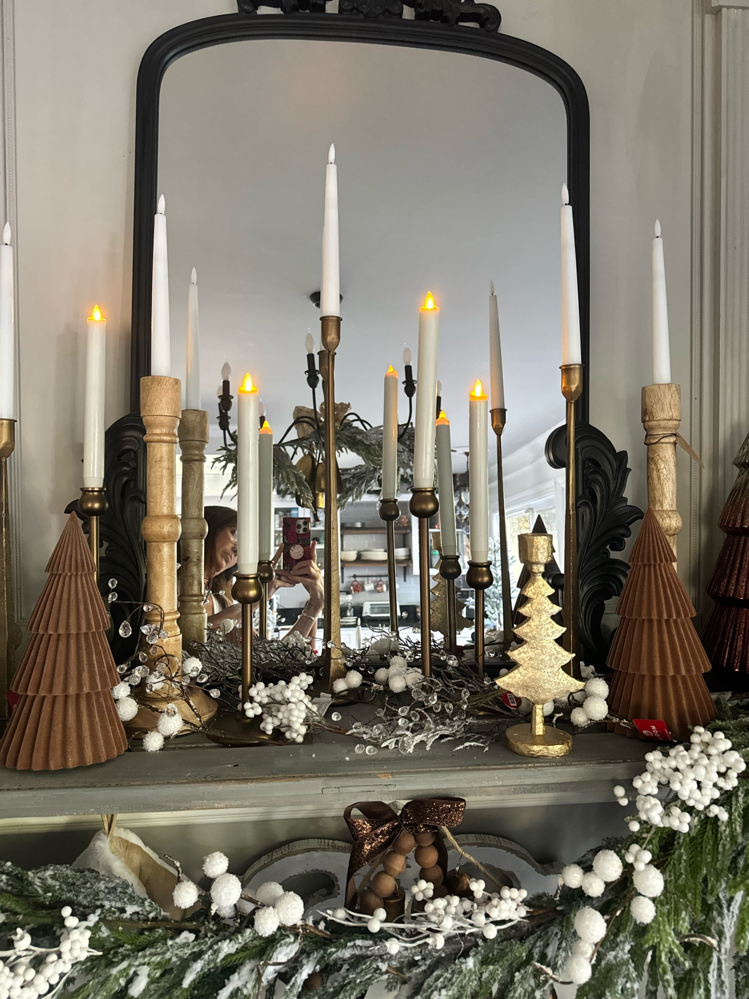 We filled this rustic Christmas mantle with wooden and metal candlesticks, flameless taper candles and flocked and glass table top Christmas trees  

#LTKHoliday #LTKSeasonal #LTKhome