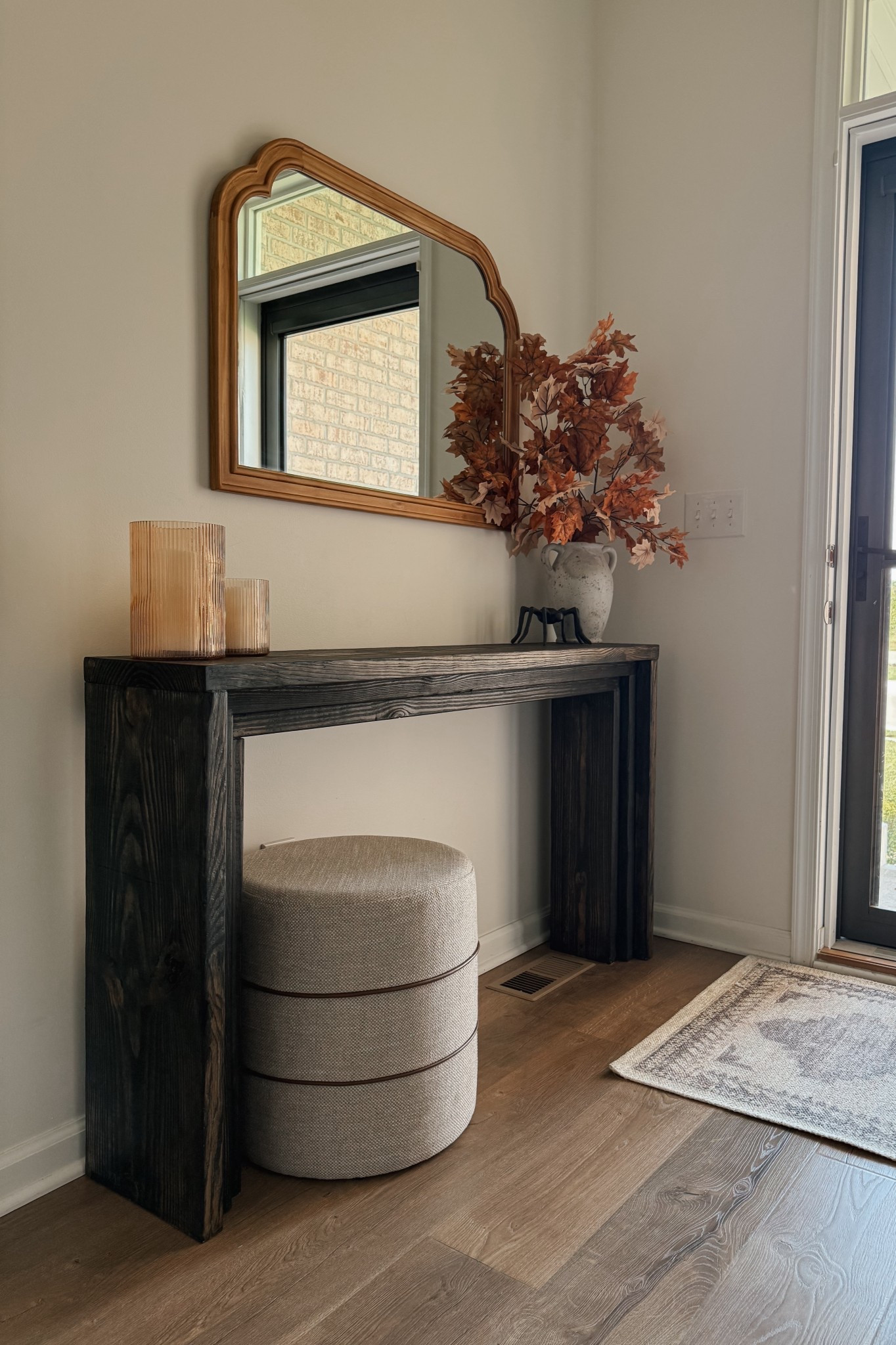 I wanted a statement piece for our entryway without spending a fortune, so I built this custom entryway table using just three pieces of wood for $45. The simple, clean lines give it a modern, high-end look, while the natural wood knots adds warmth and character to the space. It’s the perfect size for layering decor, like a mirror or seasonal accents and it proves you don’t need to spend hundreds to create a beautiful, functional piece of furniture. 

 #LTKHome #LTKSeasonal #LTKHalloween