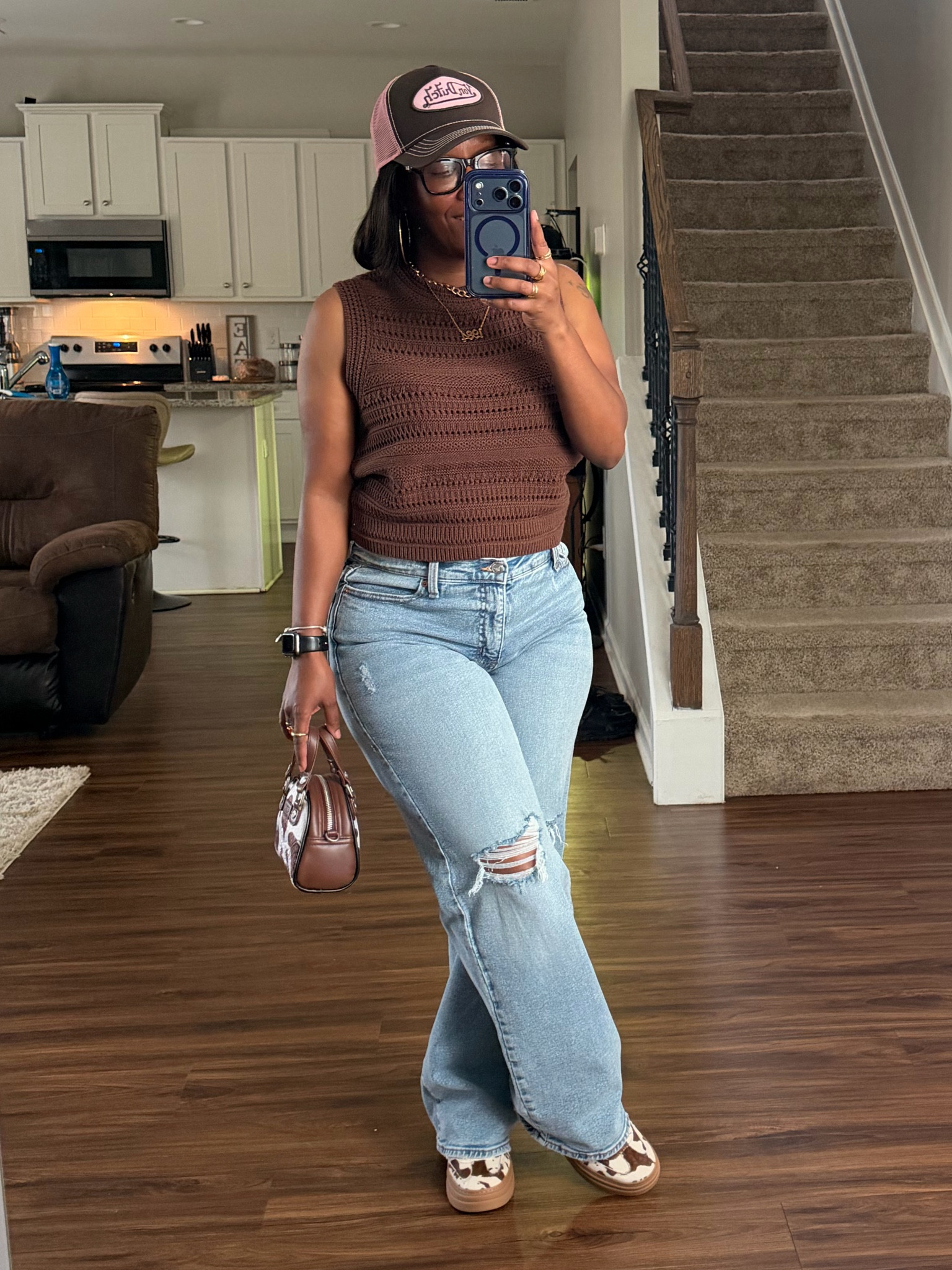 Outfit of the day 🤎

I’m wearing a brown sleeveless shirt with high waisted distressed jeans, brown and pink von Dutch trucker hat, cow print von Dutch mini purse, cow print Steve Madden sneakers

I’m 5’1 140lbs

#LTKOver40 #LTKPetite #LTKootd
