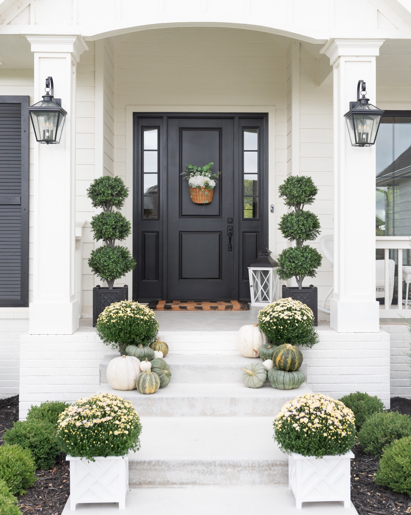 Fall Front Porch Decor! #falldecor #mums #pumpkins #planters #frontdoor #rug #outdoor #grandmillennial #topiaries #outdoorlights 

#LTKHoliday #LTKSeasonal #LTKhome