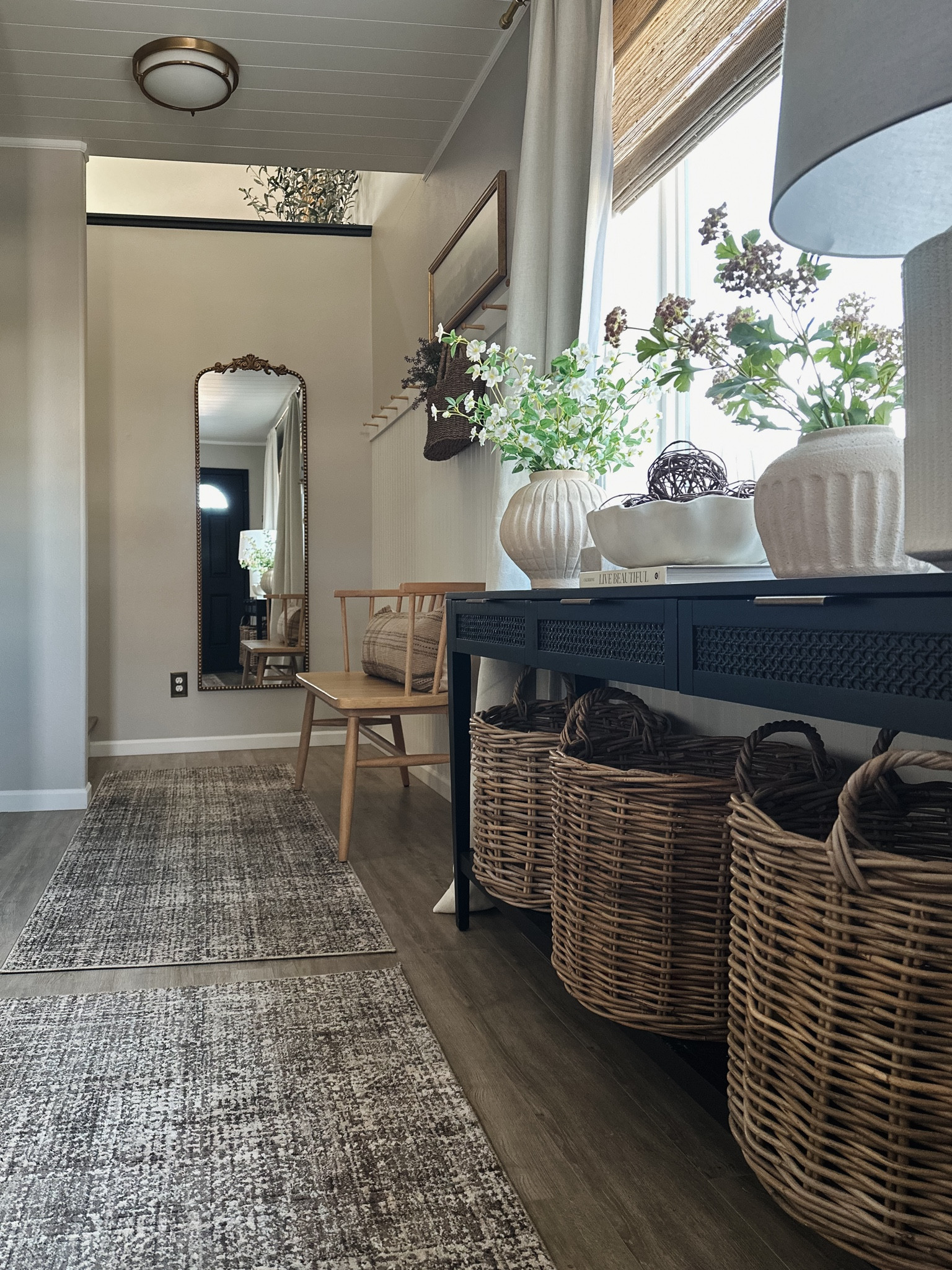 Spring refresh in our entryway! 

Black console table, studio McGee decor, target home decor, woven basket, Angela rose x Loloi rug, ceramic white lamp, brass full length mirror, wood hearth and hand bench, lumbar pillow, scalloped bowl, spring stems, ceramic vases, pink flower stems, white flower stems 

#LTKstyletip #LTKhome #LTKxTarget
