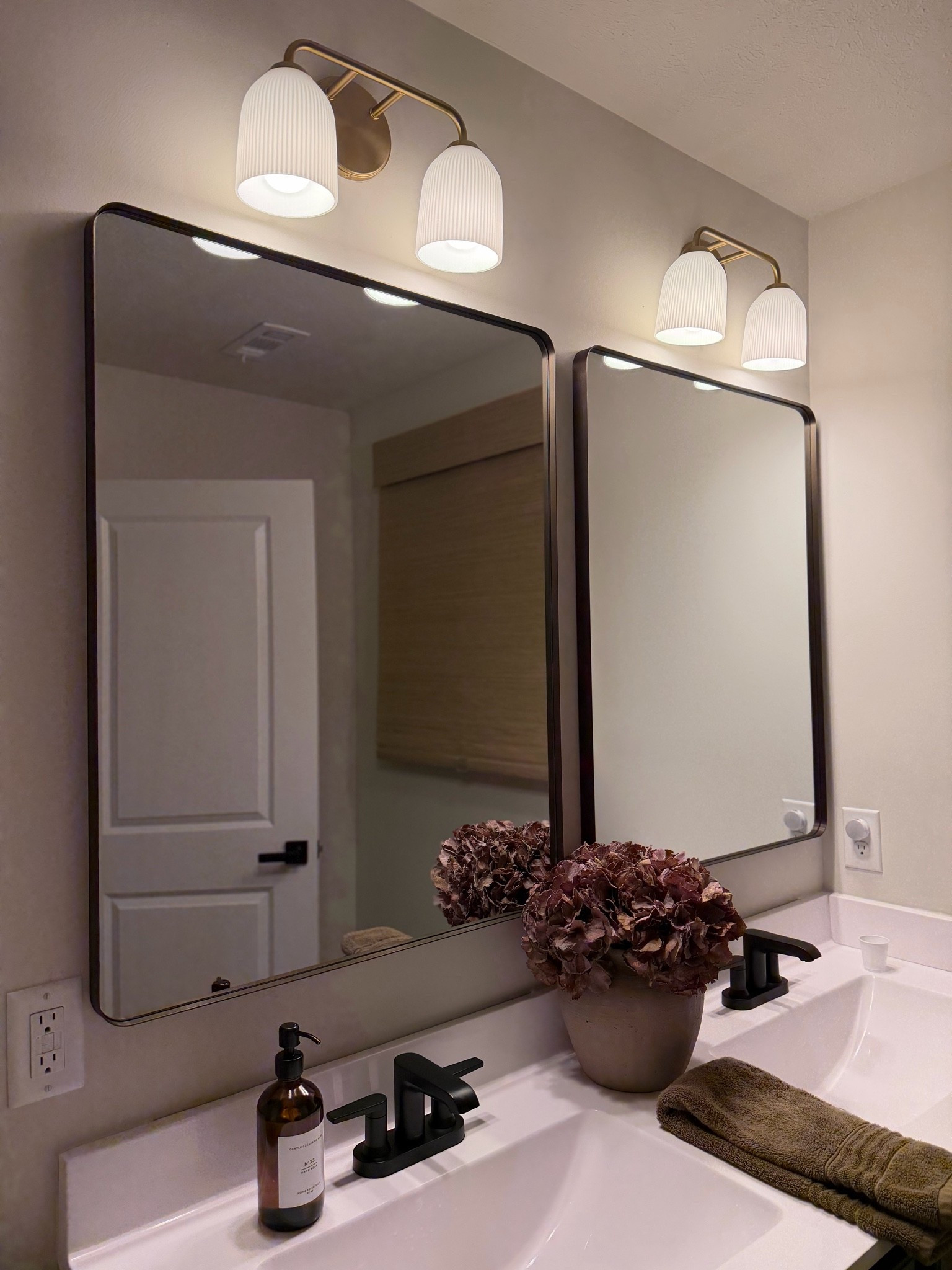 Bronze mirror, rectangle mirror, bathroom mirror, brass lighting, beige vase, oatmeal vase, brown hand towel, brown soap dispenser

#LTKSeasonal #LTKHome #LTKSaleAlert