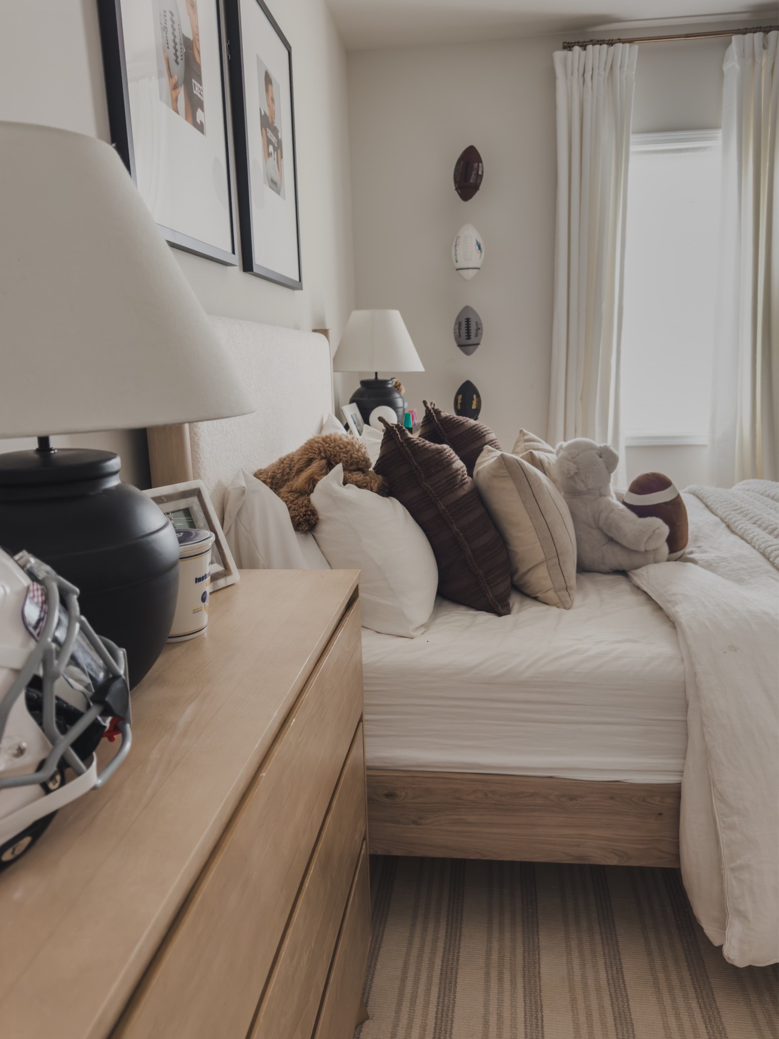 Sharing another view of my tween songs sports theme bedroom featuring some of my favorite furniture finds! Both are in the prettiest neutral wood color, have held up incredibly well and the nightstands (actually dressers) offer plenty of storage! 

Also, sharing all of his cozy bedding details. One of his requests — “I want my bed to be as comfy as yours” 🤍 

Furniture finds, boys bedroom inspo, teen boy, plank and beam, Ashley furniture, linen bedding, Amazon finds, Loloi pillows, sports, football, shop the look!

#LTKSaleAlert #LTKHome