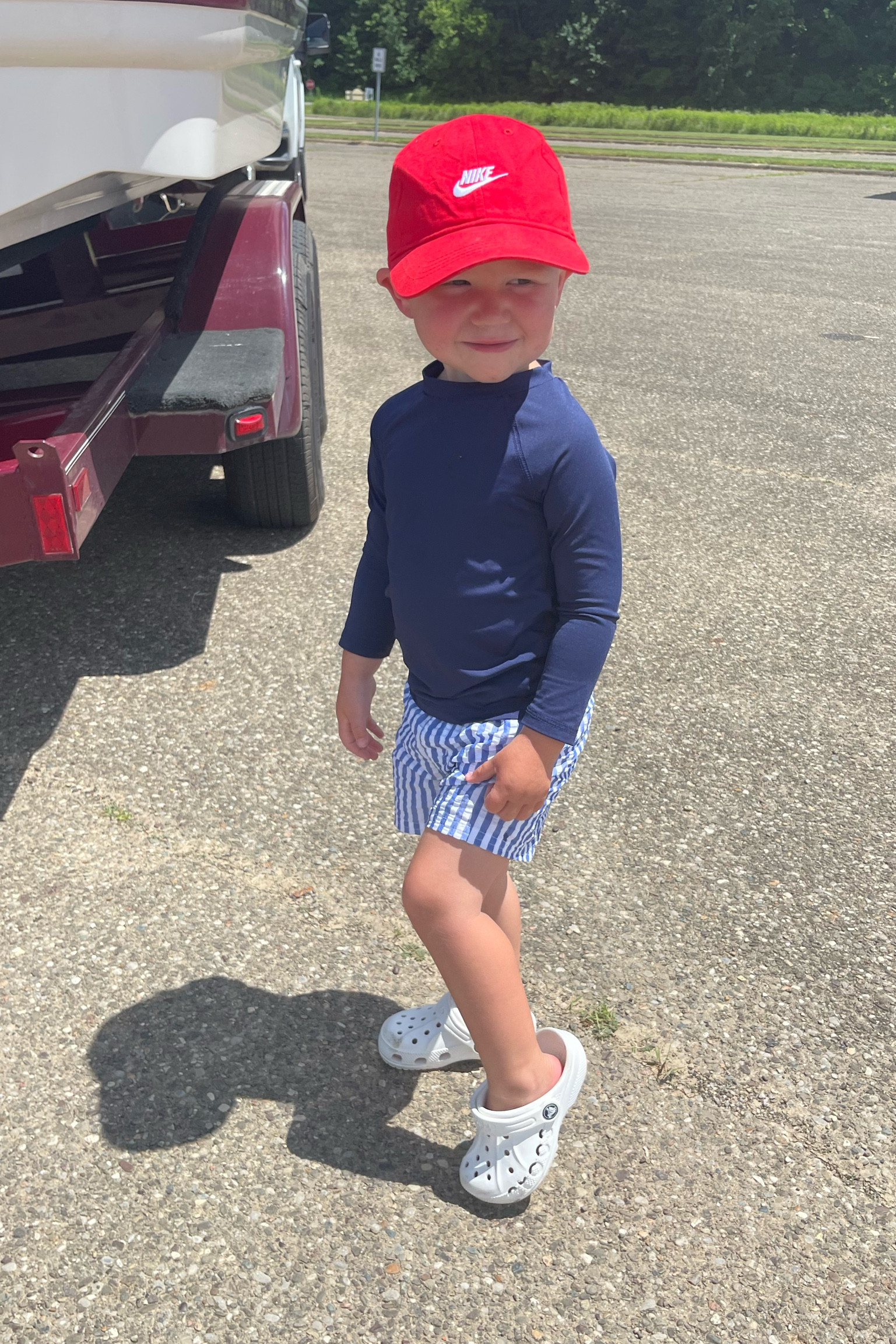 Making a splash at the lake today with my little guy! ☀️ He's rocking a Cat n Jack  swim trunks from Target rashguard in Navy also Target for sun protection. For easy on and off after swimming, he's wearing his favorite white Crocs – perfect for slippery surfaces around the lake!  #lakeswim #toddleroutfit #LTKkids #LTKsale
Image:
 * A photo of your toddler son playing at the lake in his swim outfit and white Crocs. 

