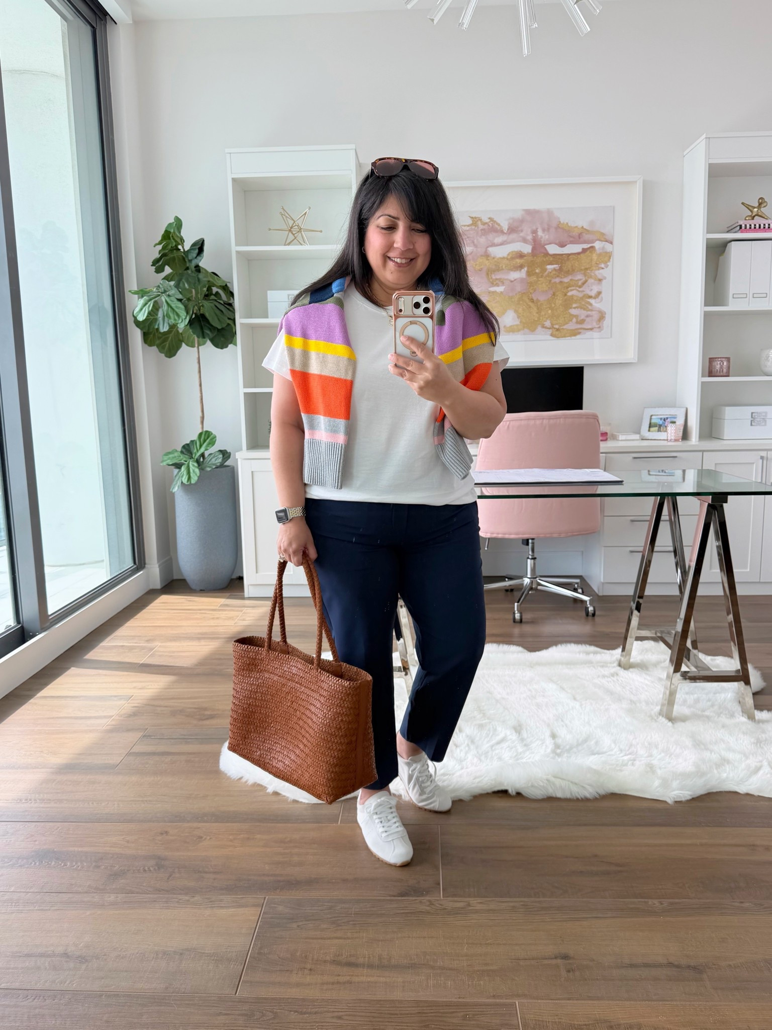 Spring outfits 2026! Layering outfits are great in the spring when the temperature fluctuates throughout the day. Love this easy casual everyday outfit that can be worn as a travel outfit or even business casual workwear. Wear the sweater when it’s cooler or throw it over your shoulders as the day warms up. Aren’t the colors in this cotton crewneck sweater so bright, fun and happy?! Love the color combo!  Paired it with these amazing pants from Athleta and a cute pair of low profile sneakers. Added this woven tote bag which is great for everyday wear and makes a really nice work bag too that can hold your laptop and any other work related items. 

Boden striped sweater size large. Athleta white tee size XL. Athleta navy pants size 12 Petite. Dolce Vita sneakers. If in between sizes, size up. Madewell woven tote bag. 

Spring outfits 2026, summer outfits, work outfits, business casual workwear, weekend outfit, work from home outfit, casual everyday outfit, travel outfit 

#LTKOver40 #LTKTravel #LTKootd