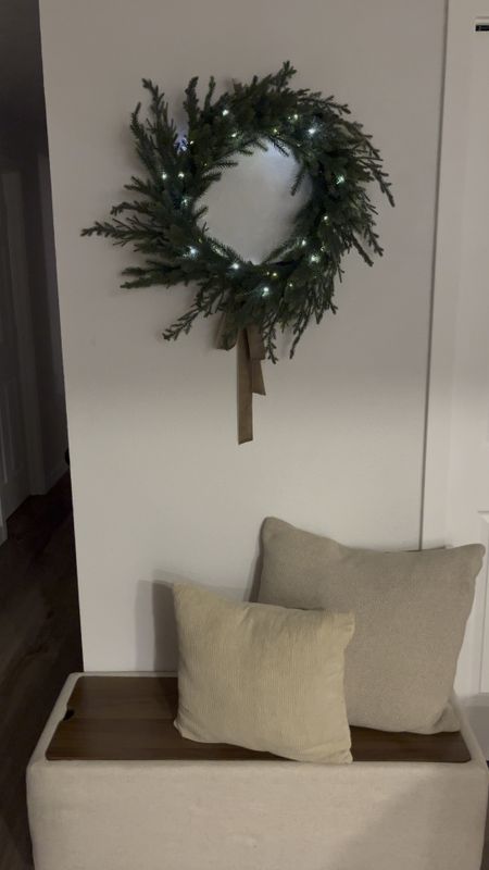 So happy with how this turned out 😍🎄 I took this beautiful faux wreath and added two sets of battery operated twinkle lights (with a green wire that blends in)! It was the perfect extra touch to an already beautiful faux wreath. The wreath comes with a neutral tan velvet ribbon that you can tie on however you like. I went for a more modern look with a long bow at the base of the wreath. Shop links to create this look! 

#LTKhome #LTKHoliday #LTKstyletip