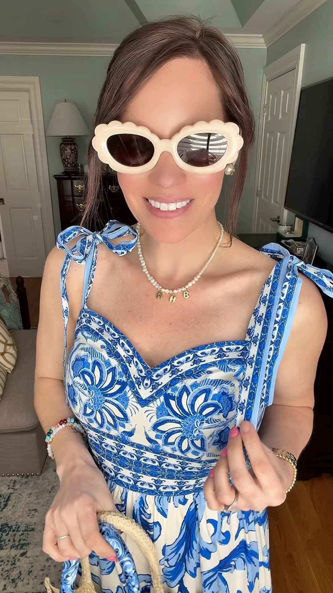 Blue & White Coastal Midi Dress Outfit 🐚💙


A classic blue and white midi dress moment that feels straight out of a coastal getaway 💙 This printed tie-shoulder dress is lightweight, feminine, and perfect for spring and summer days. I paired it with woven neutral slides, a straw beach tote with blue fish detailing, and gold statement earrings for an effortless preppy look. The tie straps and flowy tiered skirt make it so comfortable while still looking polished for brunch, vacation, or a seaside dinner.

Blue and white dress outfit, coastal style outfit, preppy summer dress, blue printed midi dress, beach vacation outfit, feminine spring style, straw beach bag outfit, classic preppy summer look. 🌊✨

#LTKPetite #LTKOver40 #LTKootd

#LTKSeasonal #LTKPetite #LTKOver40