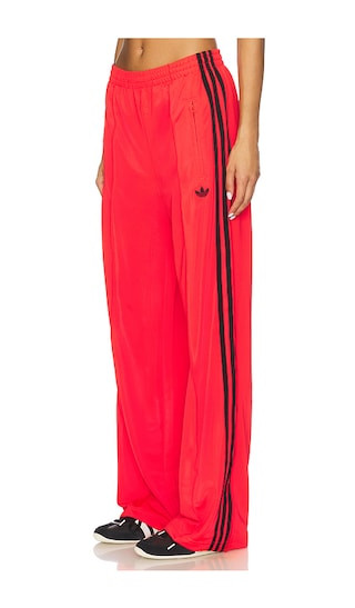 Firebird Track Pant in Lucid Red & Black | Revolve Clothing (Global)