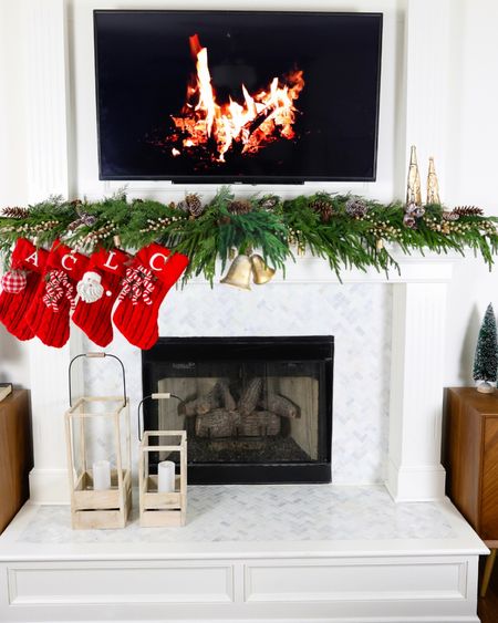 Shop this year’s Christmas mantel! This garland sells out FAST every year, so I have also linked similar garlands to check out! Stockings and small bells linked.

Large bells and gold Santa’s: Dollar General. I have also linked similar bells!

#LTKSeasonal #LTKHoliday #LTKhome