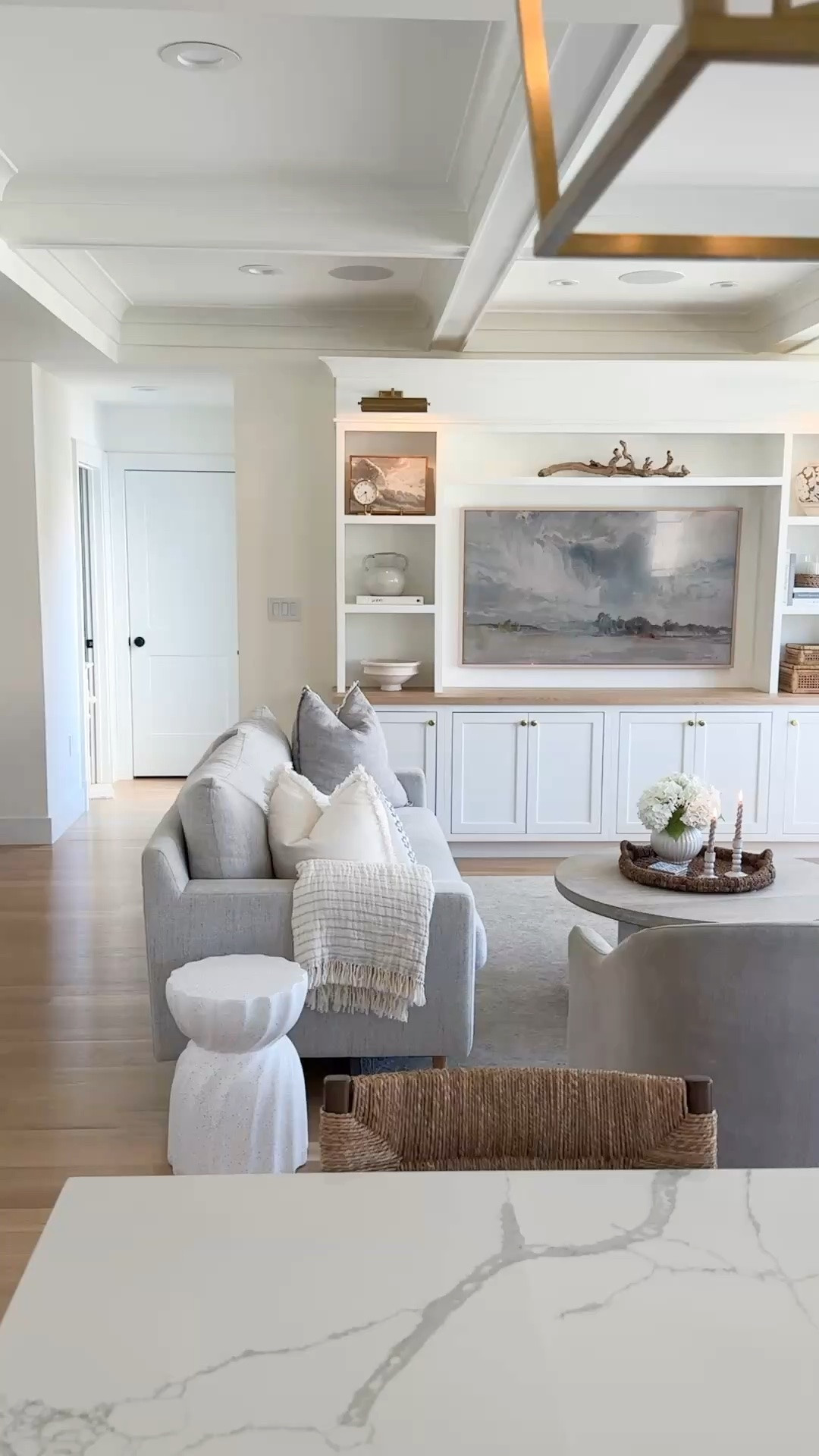 The definition of timeless, comfortable living. This space is layered with neutral performance sofas that stand up beautifully to kids, petite French country-inspired dining chairs styled as accent chairs, a whitewashed round coffee table, and collected shelf styling that adds warmth without the clutter. Cozy, functional, and designed to look beautiful for years to come.

#LTKdayinmylife #LTKHome #LTKSaleAlert