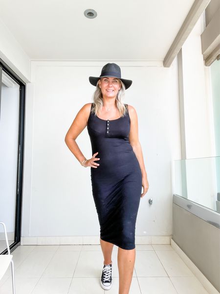 A little black dress goes a long way so I always pack one when I go on holiday. This simple black bodycon dress is the perfect length for us tall girls and fits tts (wearing a L). 

Paired with black Converse All Stars and a black straw sun hat. 