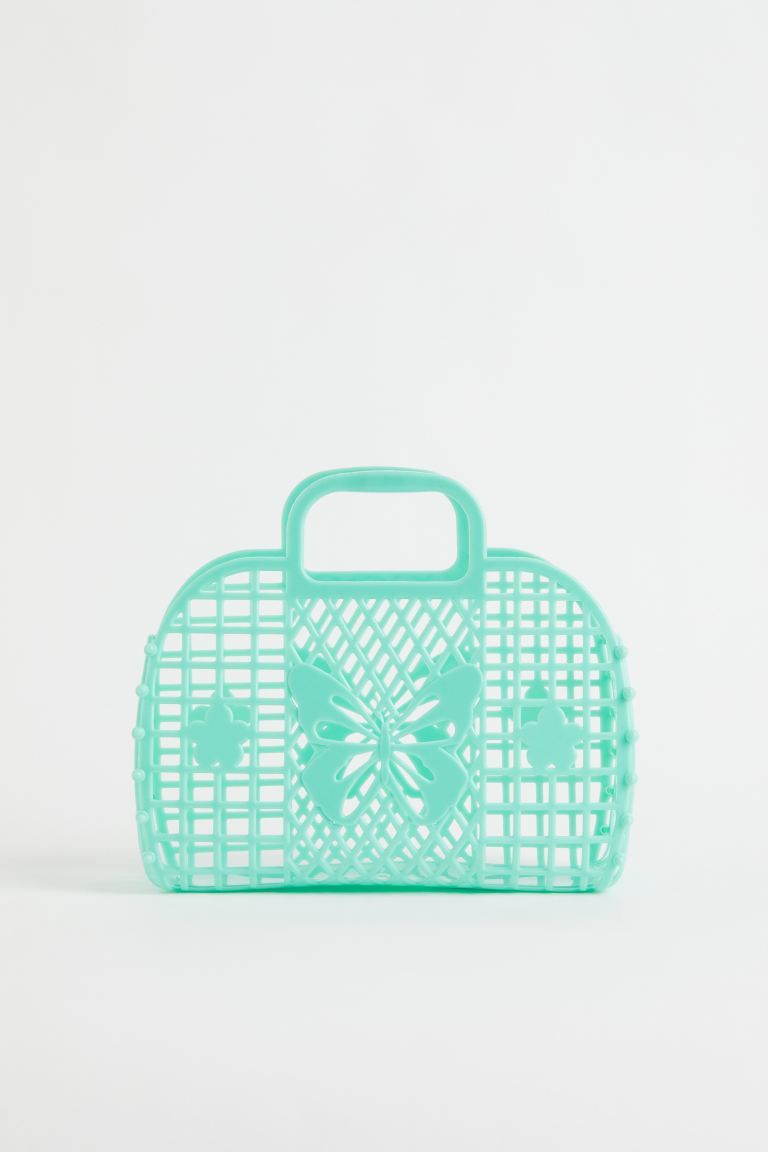 Small beach bag in plastic with a perforated pattern. Two handles at top. | H&M (US + CA)