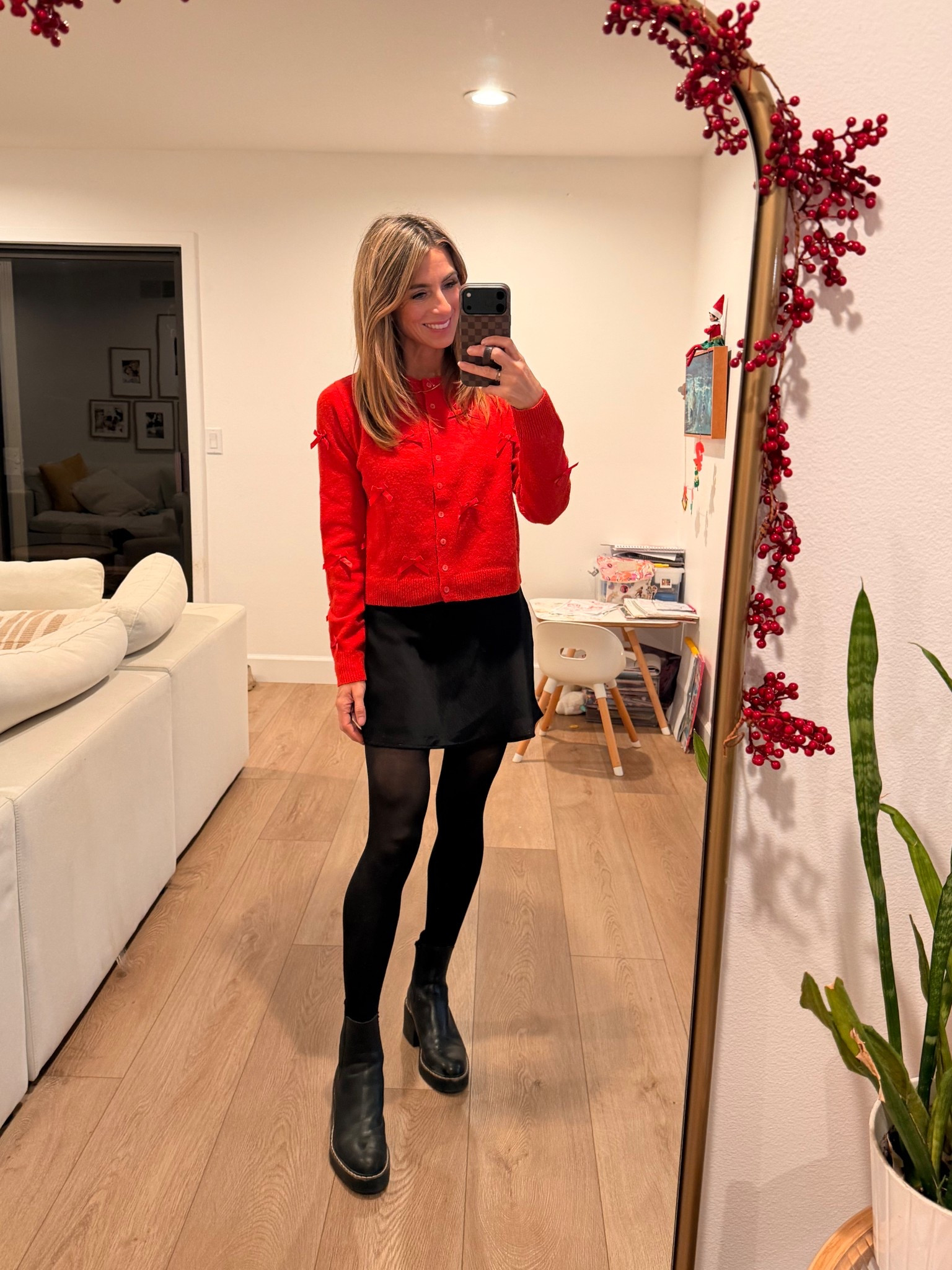 A festive holiday outfit 🎅 the sweater is super affordable, & I’ve already gotten a lot of use out of it! red sweater with bows. Black boots. Satin skirt. Black skirt. Target sweater. Holiday party outfit. Christmas outfit. Christmas sweater 

#LTKOver40 #LTKHoliday #LTKootd