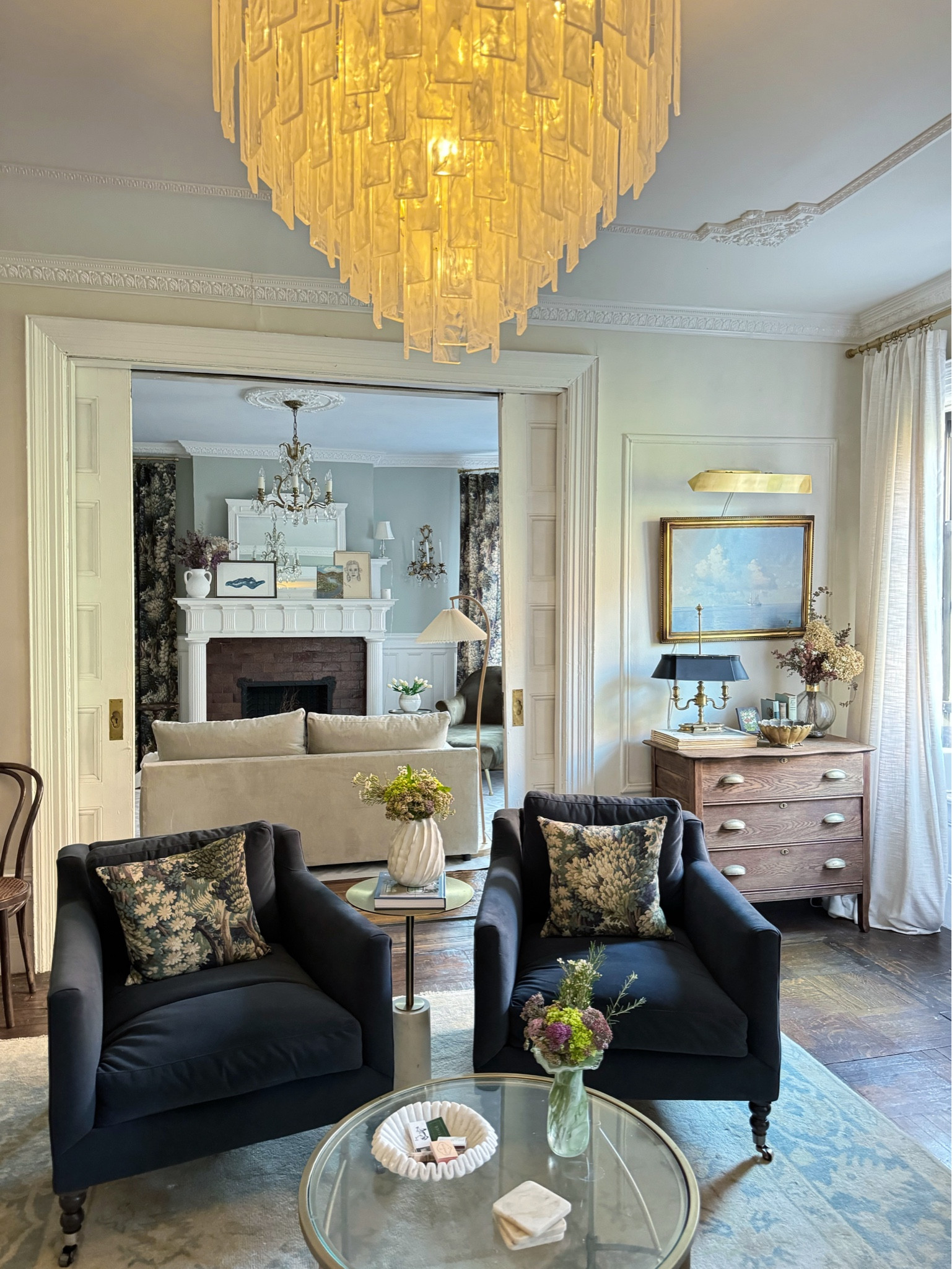 Living room, chandelier, Accent chair, printed curtains, linen curtains, gold, picture, light, molding, throw pillow, coffee table

#LTKHome #LTKSummerSales