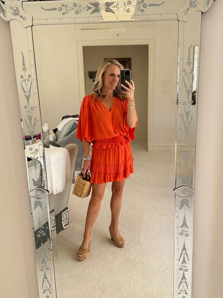 One of my favorite two piece sets for spring, summer or a beach vacation. This orange top and skirt set is so comfortable and easy to mix and match to make different outfits. I’ve paired it with my favorite cork wedges and a handwoven raffia handbag
