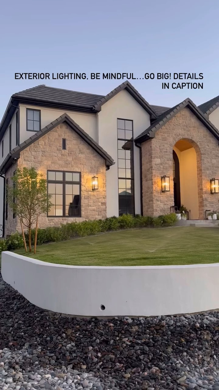Save for later: when it comes to exterior lighting go big! 
Comment SHOP for a link to these lights.

Whether you are building or just updating your home exterior lights can really make a large impact. This is a simple upgrade that can even help sell your house.

We used extra large lights on the front of the main entrance and went with large on the other areas. This saved money and still gave us the impact of the x-large lights. 

#exterior #light #lighting #exteriorlighting #facade #designbuild #dreamhome #customhomes #mydomaine #englishhome #stone #homeinspiration #homedesign #homeinspo #modernlighting #modernhome #interiordesignideas #interiordesigners #remodeling #sellyourhome #arch #homeexterior #retainingwall #blackwindows