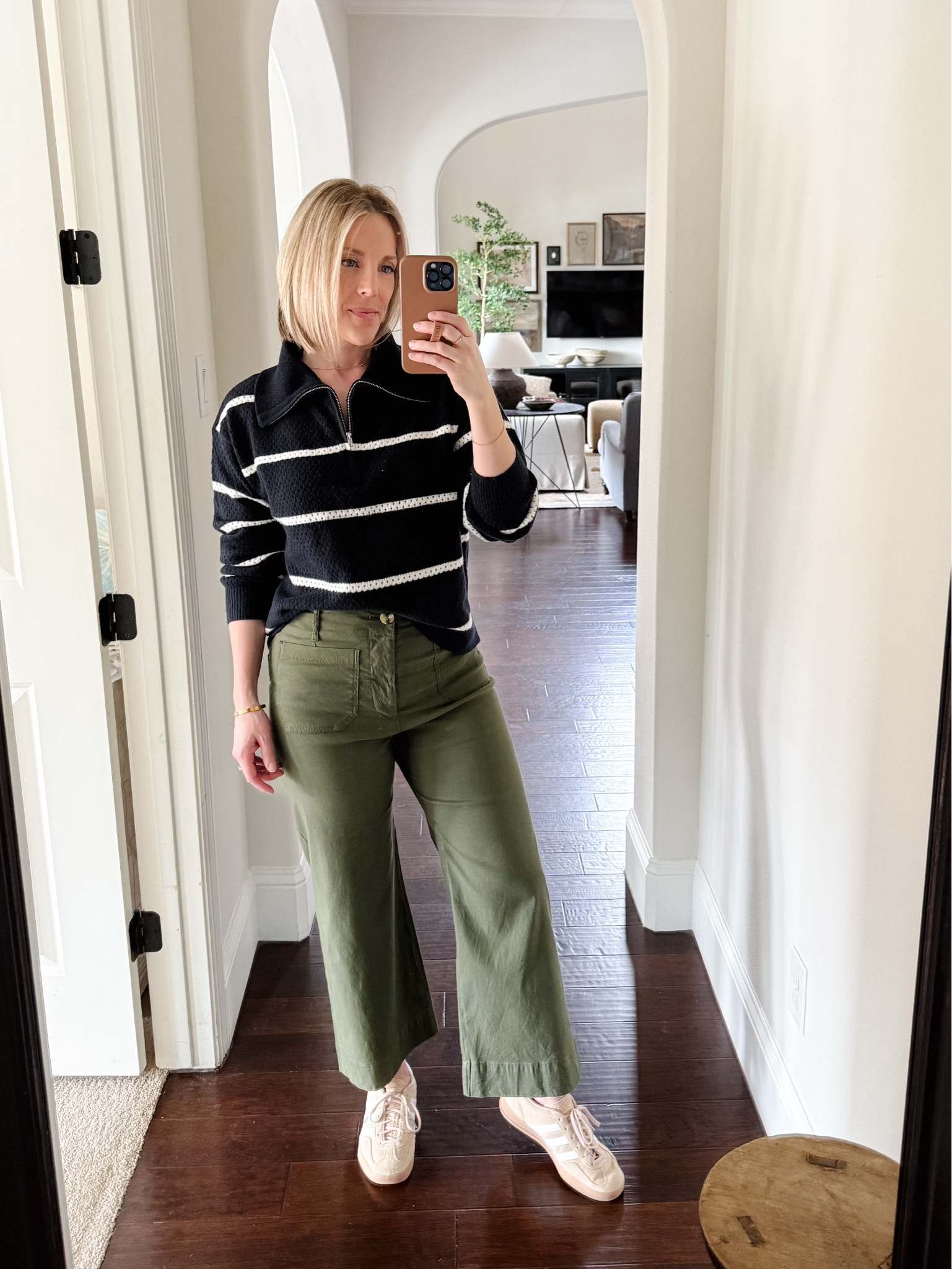 Navy stripe half zip sweater, the most comfortable pants in the world in green, and my beige Gazelle Adidas





#LTKMidsize #LTKOver40