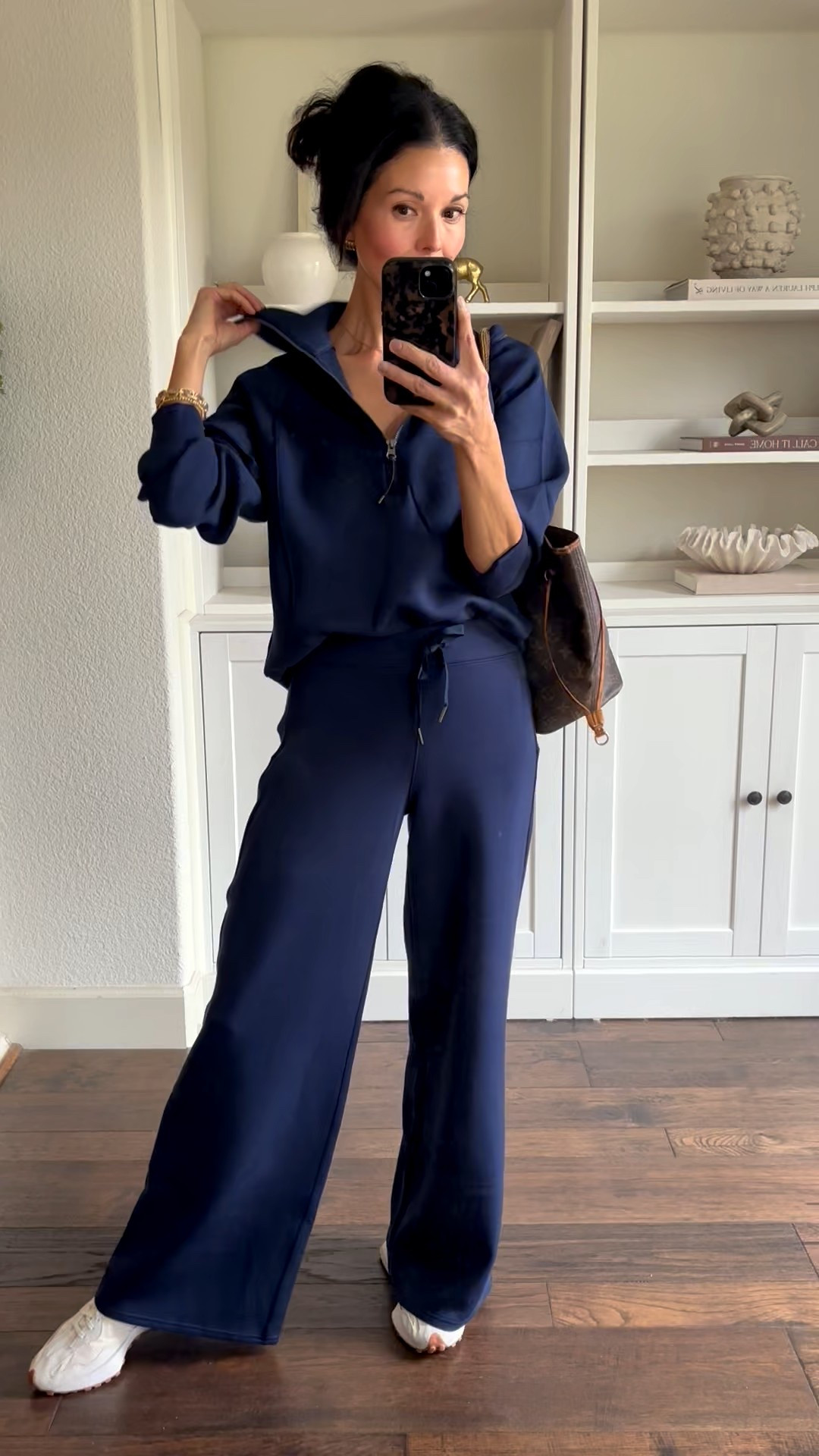 Spanx air essentials wide leg pants and matching are essentials quarter zip sweatshirt. SO buttery soft. True to size. I’m wearing xs pants and a small quarter zip sweatshirt comes in several colors including this navy. 

Mom attire 
Elevated athleisure 
Wide leg athleisure pants 
School pick up outfit idea 
Travel outfit 
Black Friday spanx sale 

#LTKTravel #LTKCyberWeek #LTKOver40