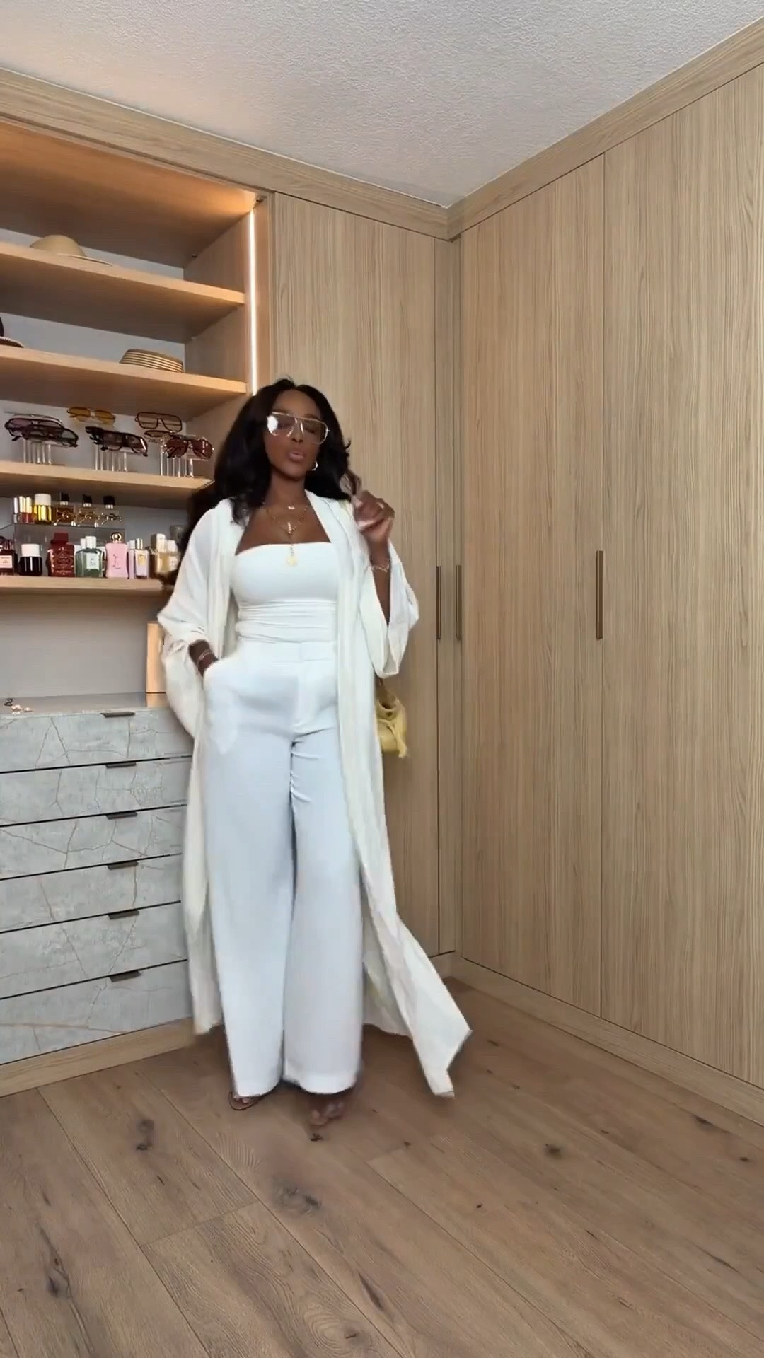 Hi Babes!

Okay this monochrome neutral moment feels SO expensive and effortless 🤍 The flowy wide leg pants paired with the matching long duster gives that elevated resort energy while still being ridiculously comfortable. I love how the fitted bandeau balances out the movement of the layers so it still keeps shape on a curvy petite body.

This is one of those outfits that instantly makes you look put together with minimal effort — especially styled with oversized sunnies, gold jewelry, and a soft neutral bag. The kind of look people stop you for.

Where to wear this:
• Resort vacations
• Beachside dinners
• Summer brunch dates
• Rooftop happy hours
• Cruise outfits
• Elevated travel days

Undergarments: seamless nude thong and sticky bra or bandeau-friendly cups to keep the neckline smooth and clean.

Everything is linked below

xx Kira | IG: KirasFashionFinds

34D - 27 - 40 • Size Small or 4