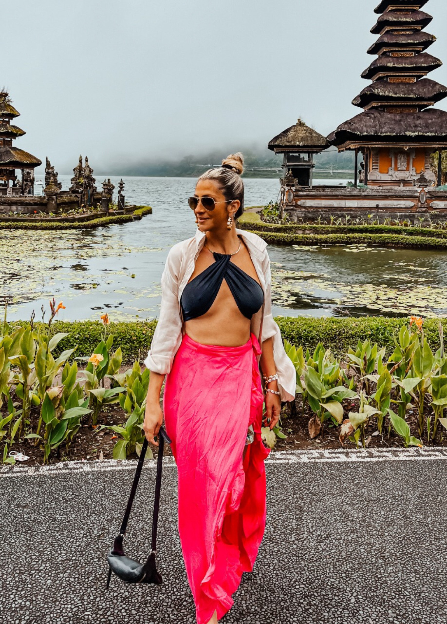 Casual look. Vacation outfit. Black bikini top. Button down shirt. Crossed  top. . Pink beach wrap. Pink maxi skirt. Sunglasses. Black crossbody bag. #croptop #summerstyle #colorful #pink #Summerlook #pinkskirt #blacktop #beach #beachchic #crossedtop #fashioninspiration #stylingideas #LTKFashion 

#LTKtravel #LTKfit #LTKstyletip
