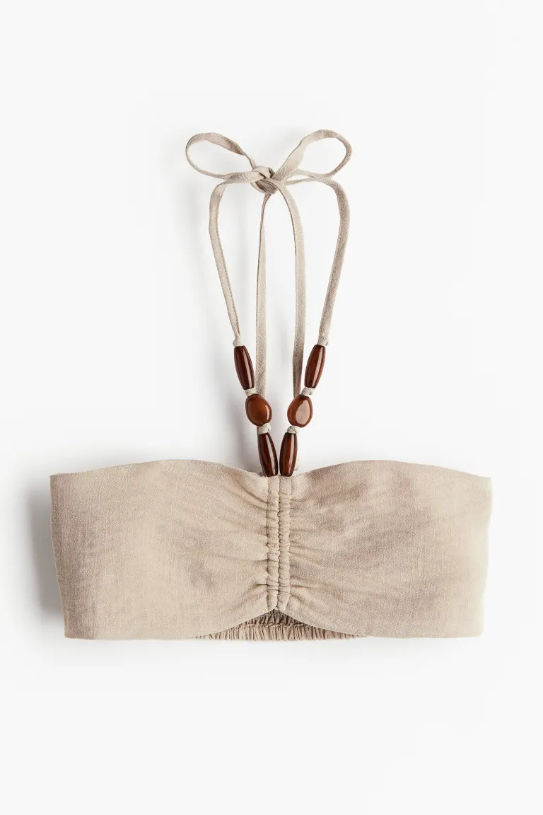 Top de playa con cuentas decorativas | H&M (FR, IT, ES, PT, BE)