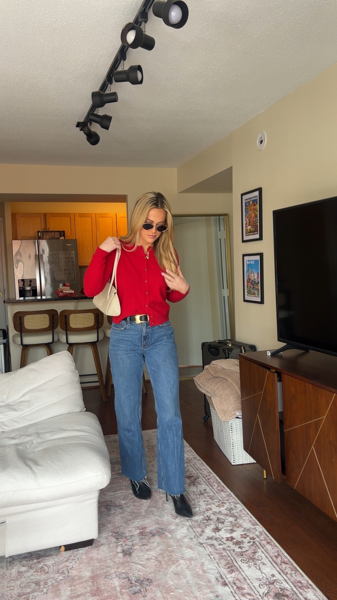 Spring transitional outfit, baggy jeans, kitten bootie heel, purse trendy, miu miu sunglasses