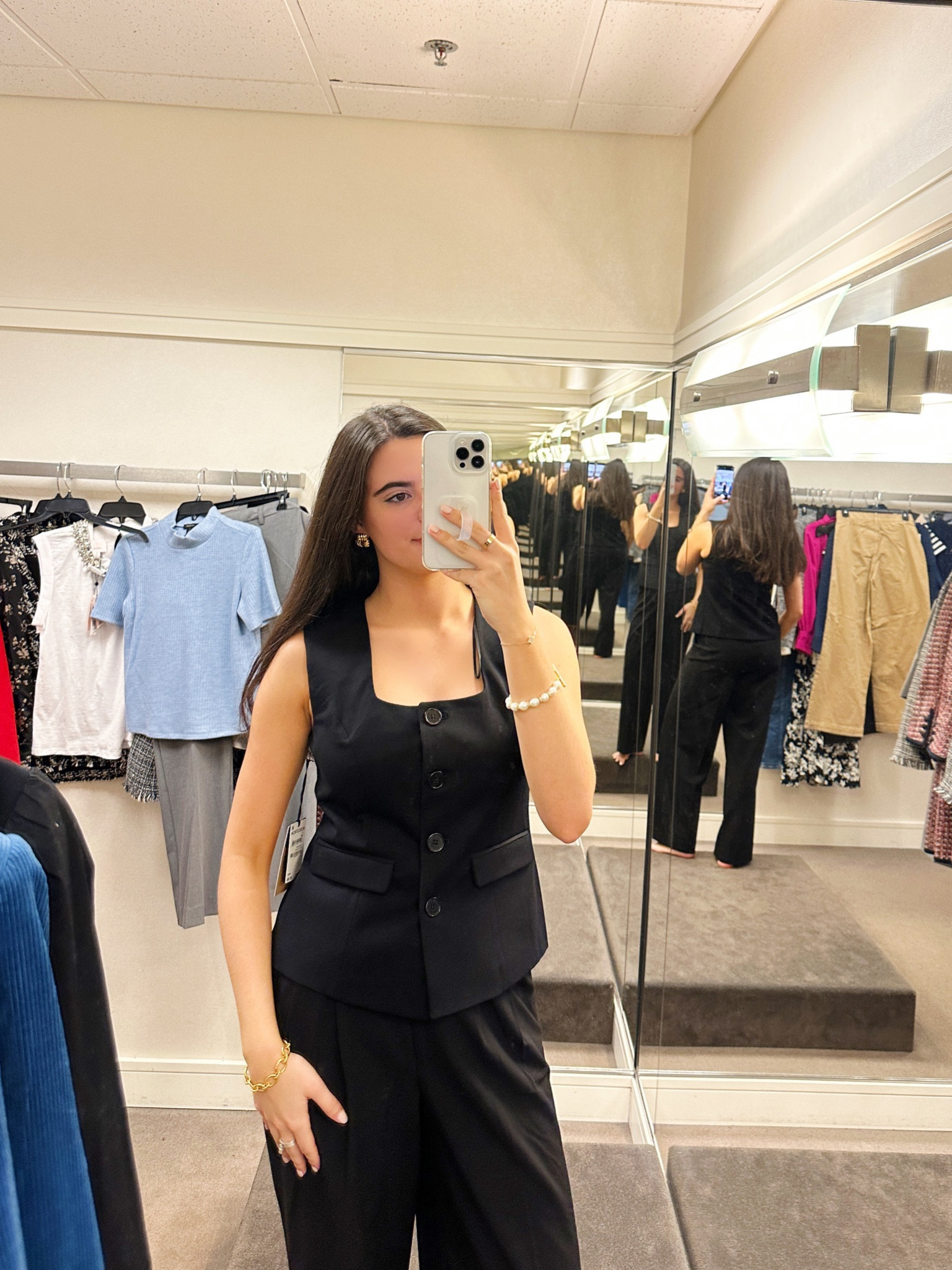 This black vest can be worn separately for going out or with the black trousers for a sleek dressy look!