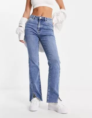 Urban Revivo split hem twisted hem flared jeans in blue | ASOS (Global)