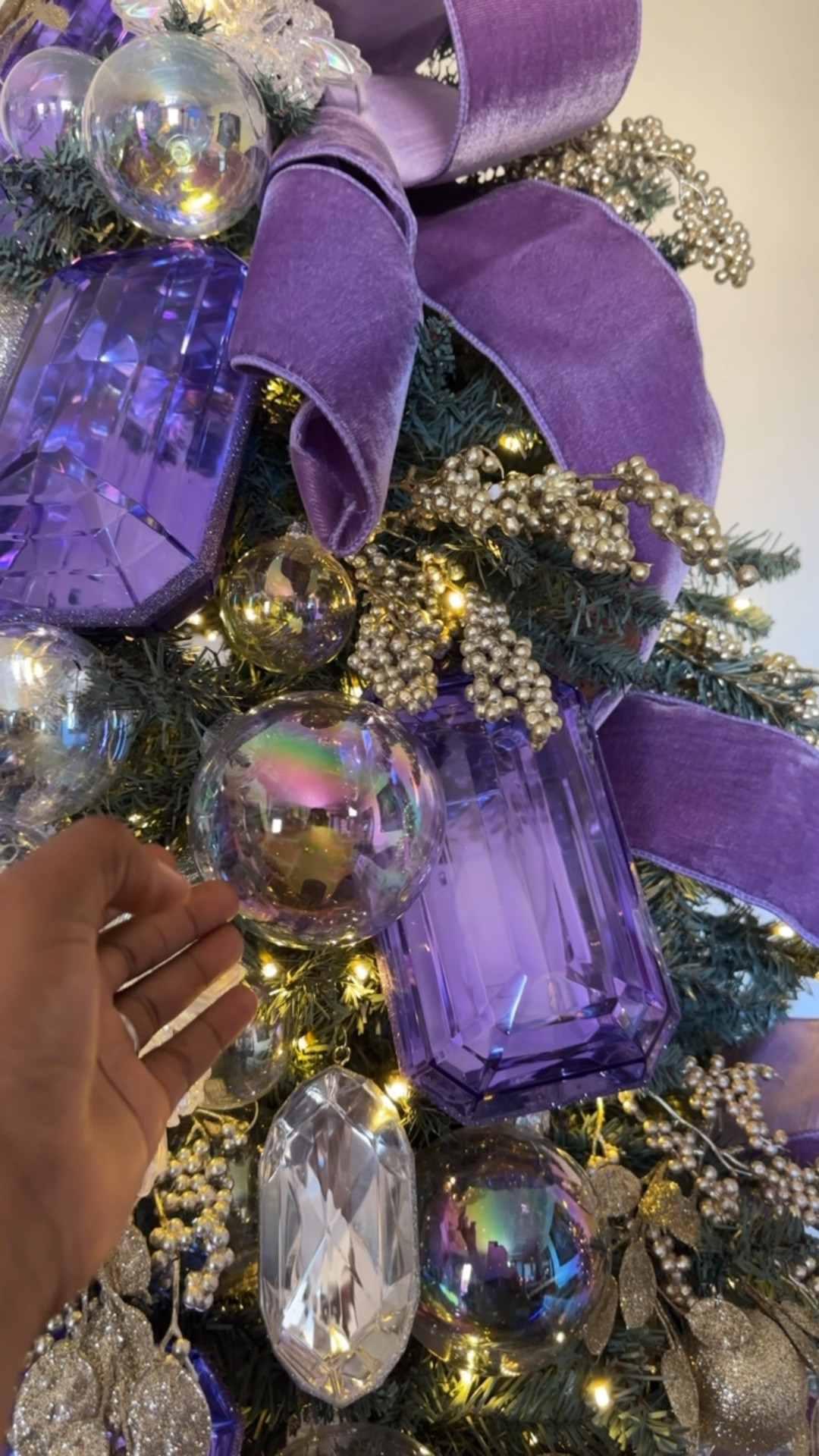 The decor elements for this tree include lots of statement pieces. There are purple gems, crystal gems in unique shapes, velvet ribbon and iridescent bubble ornaments. Do you like the bubble ornaments better on a flocked or green Christmas tree? I’m leaning toward flocked, but I’m curious about your opinion. The trees in this photo are the Tribeca Spruce Blue and the mini Queen Flock from King of Christmas. One of my favorite trees yet from my holiday series. I’m switching back to fall themes soon…maybe. But I’ll never not be stuck on Christmas. 😻🤣🦄

#LTKSeasonal #LTKOver40 #LTKHome