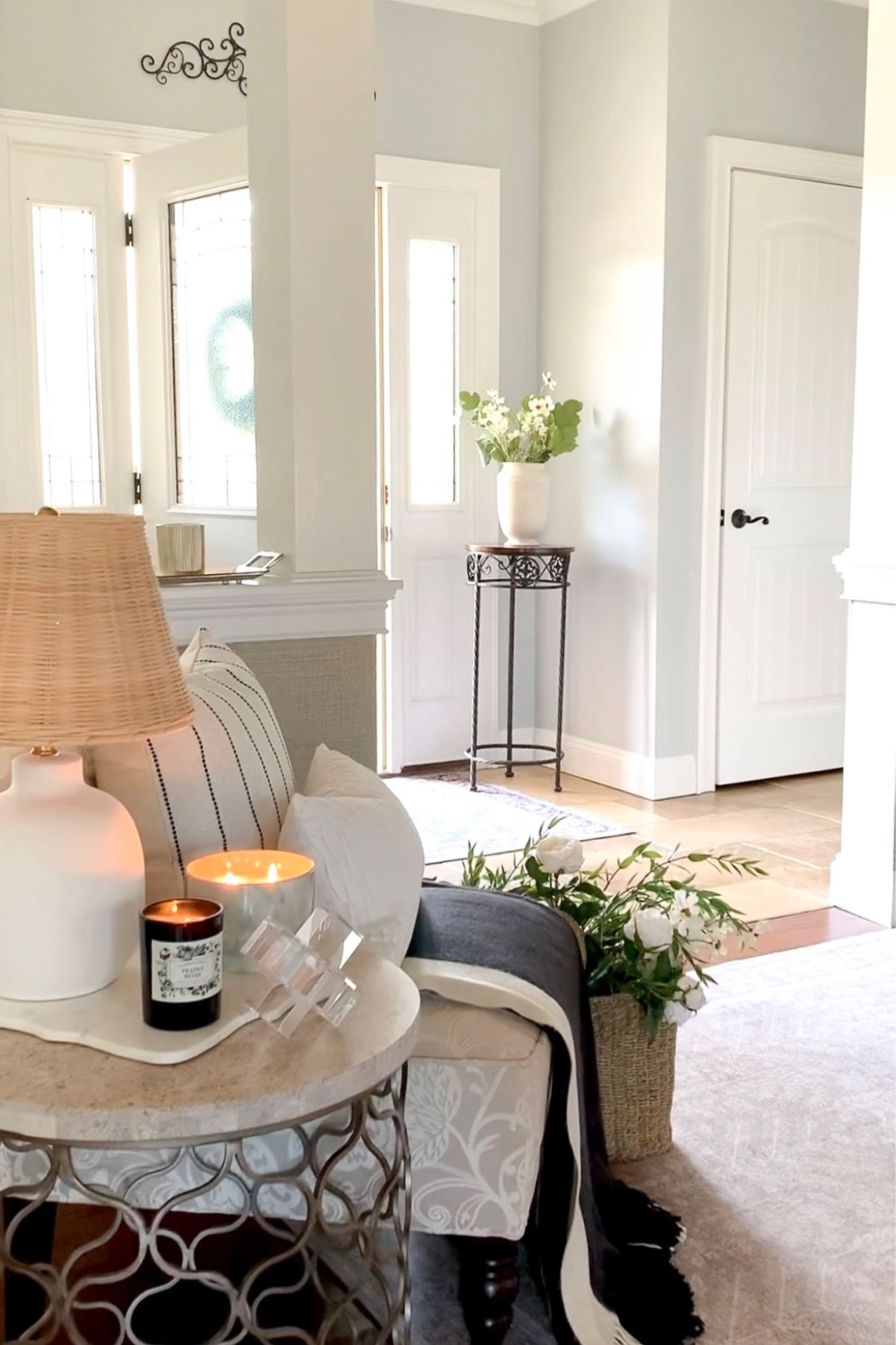 Entryway, foyer refresh. Rattan lamp, color block throw blanket, black and white throw pillow, neutral area rug on sale, white florals, candle, basket, vases. Home decor accessories. 

#LTKfindsunder50 #LTKhome #LTKsalealert