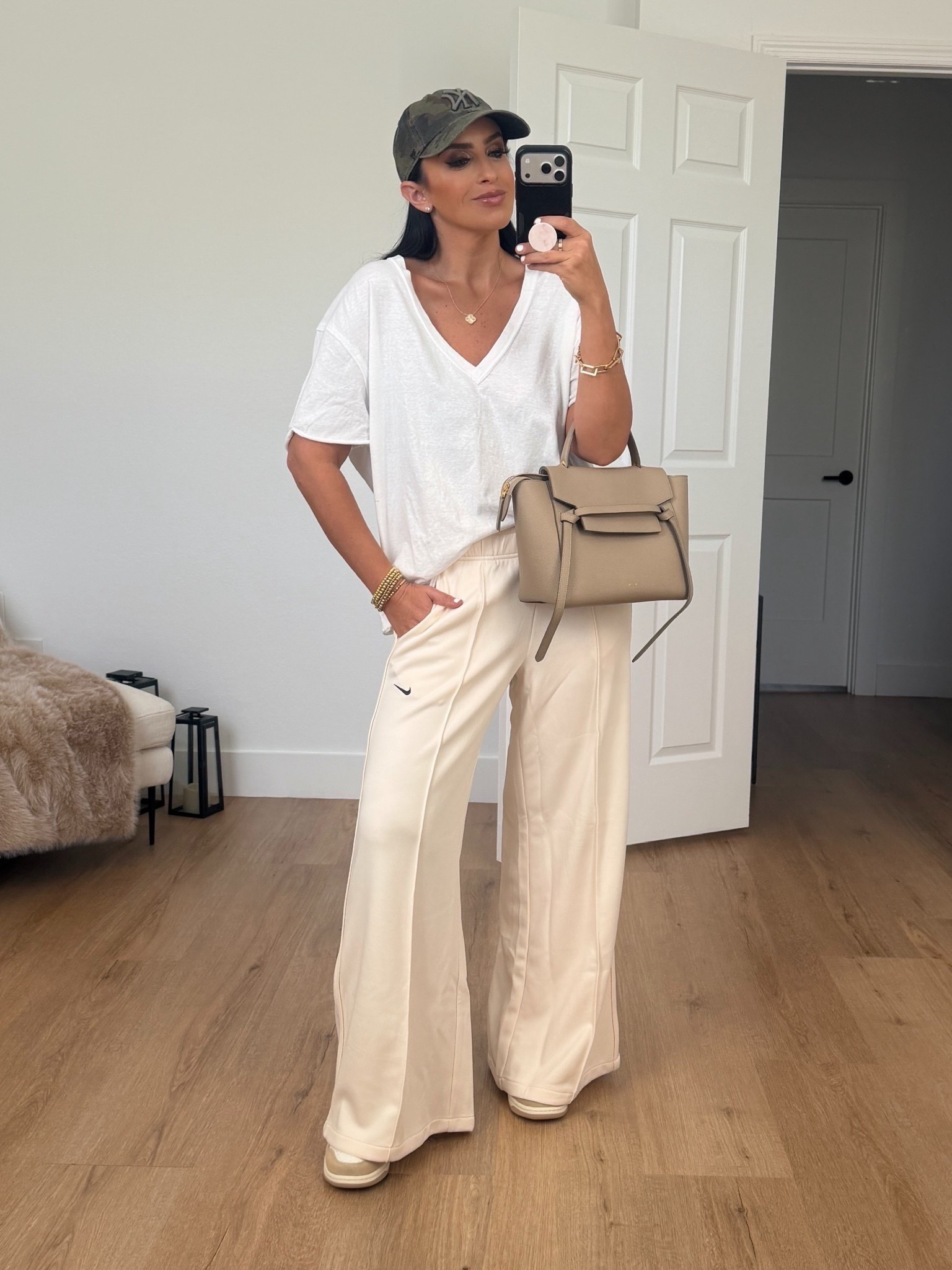 Nike Sportswear Women's Mid-Rise Wide-Leg Track Pants wearing size small. Free People Nina V-Neck Cotton T-Shirt wearing size XS