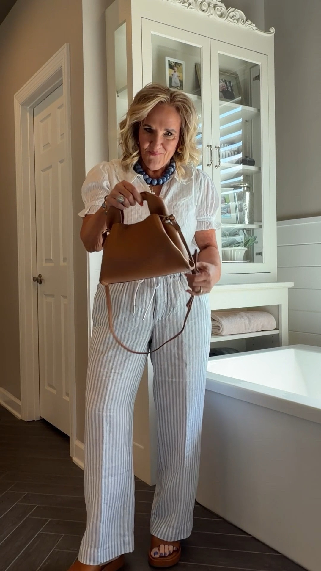 Top size medium 
Striped linen pants size medium inseam 28. 4 lengths available. 
New purse is fantastic!

#LTKOver40 #LTKSeasonal #LTKootd