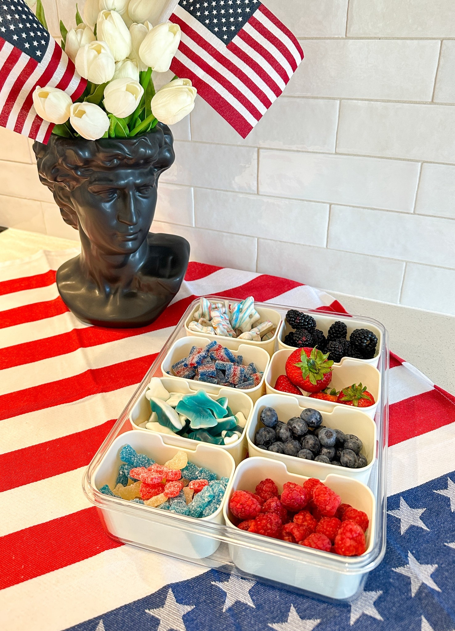 Bringing the ultimate snack hack to this year’s 4th of July parade: a festive red, white, and blue snackle box! It’s packed with easy-to-grab treats to keep everyone happy while we wait for the floats, marching bands, and fireworks.
Here’s what’s inside:
	•	Fresh berries like strawberries, blueberries, blackberries, and raspberries
	•	Popcorn, pretzels, crackers, red licorice, and mini marshmallows
	•	Festive candies in red, white, and blue
	•	Cheese cubes and snack mixes for variety
This portable and reusable snackle box is a total game-changer for parade day—keeping snacks organized, fun, and festive!

Independence Day snacks, 4th of July snack ideas, snackle box inspiration, portable snack organizer, parade treats, red white and blue snacks, family-friendly snack ideas, patriotic party food, easy holiday snacks, summer celebration treats

#LTKSeasonal #LTKSummerEdit #LTKFamily