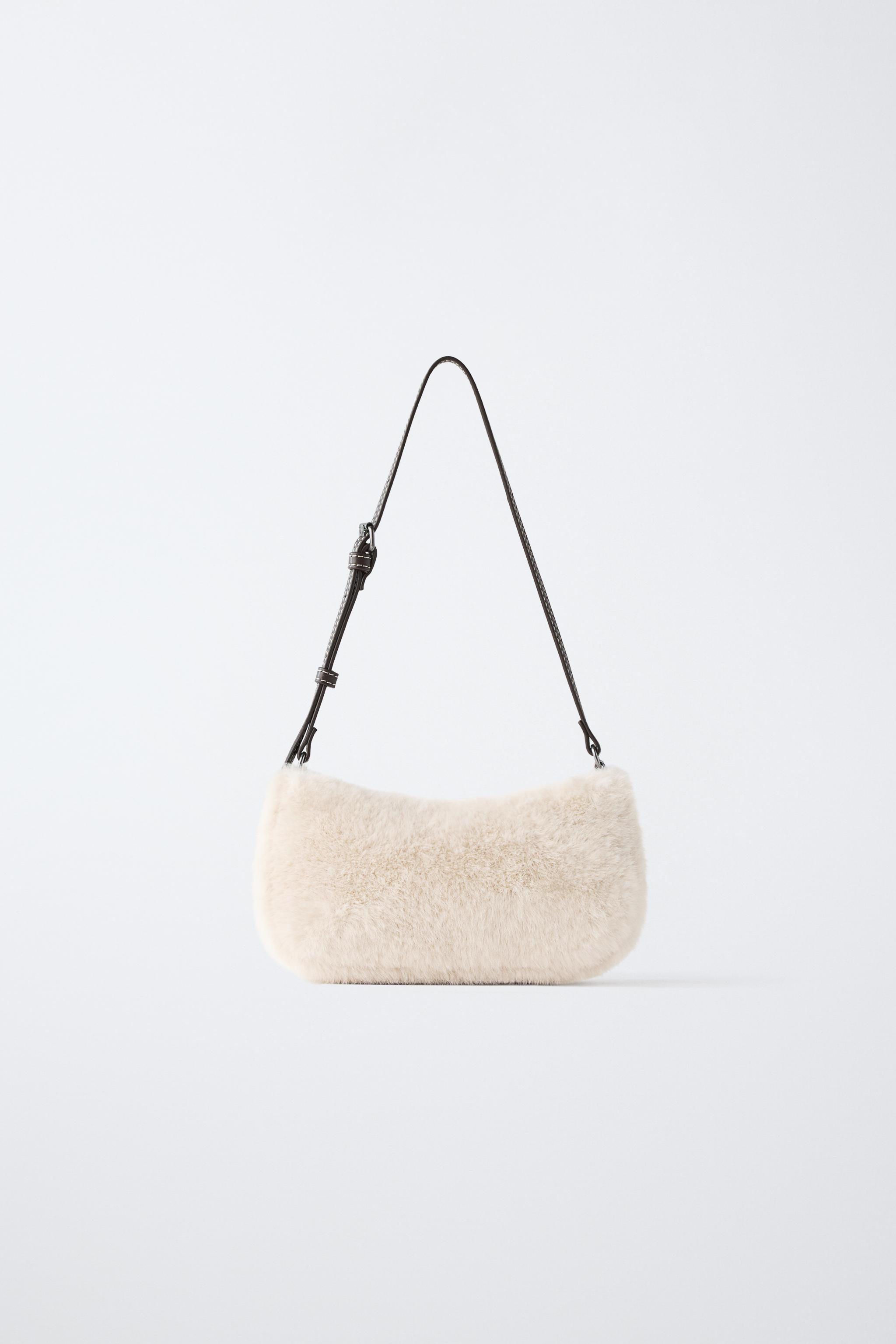 Shoulder bag with a soft sheepskin-effect finish. Features a main compartment with zip fastening ... | Zara UK