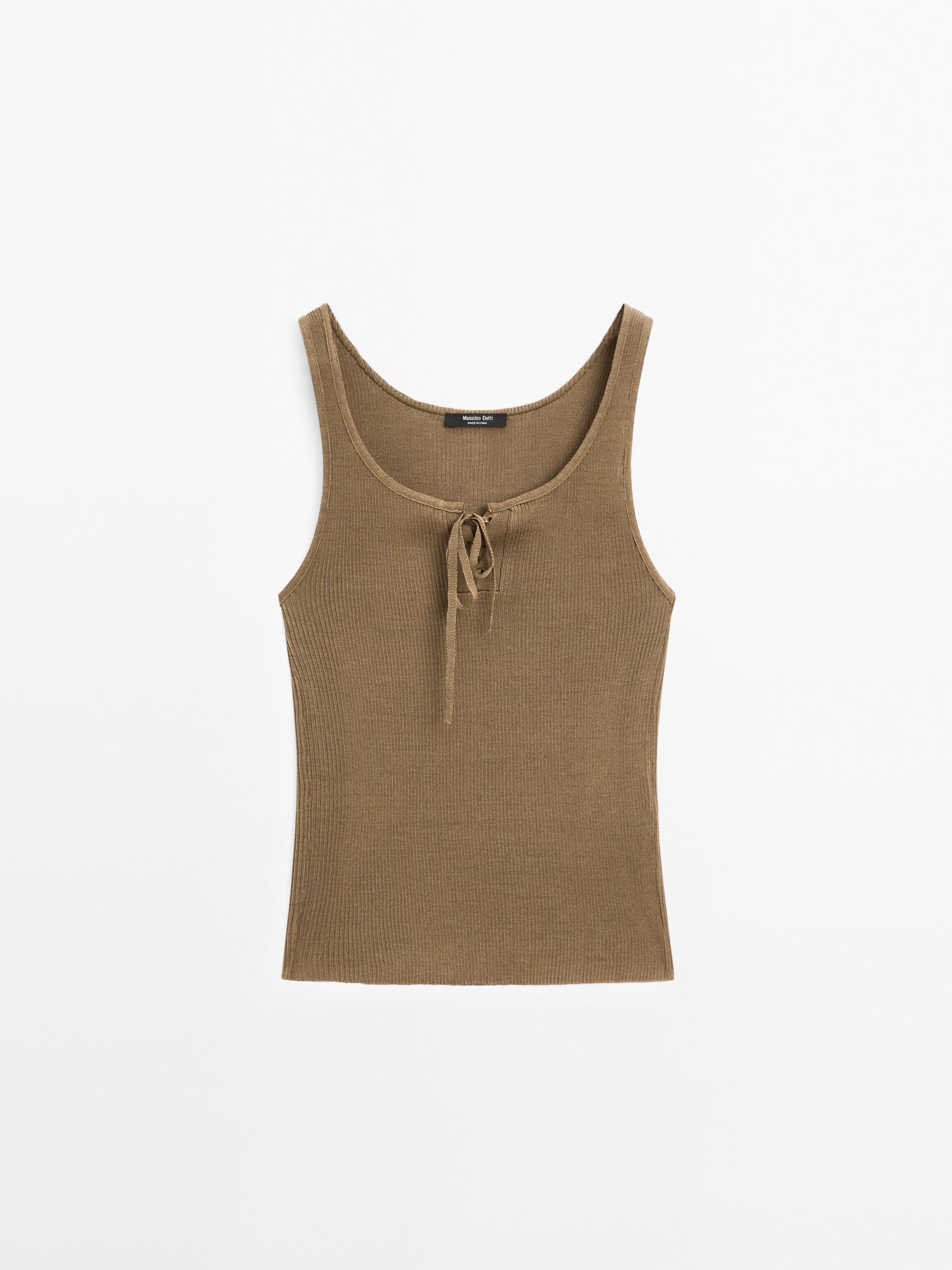 Knit top made of 100% cotton fabric. Round neck. Sleeveless. Front closure with corset drawstring... | Massimo Dutti UK