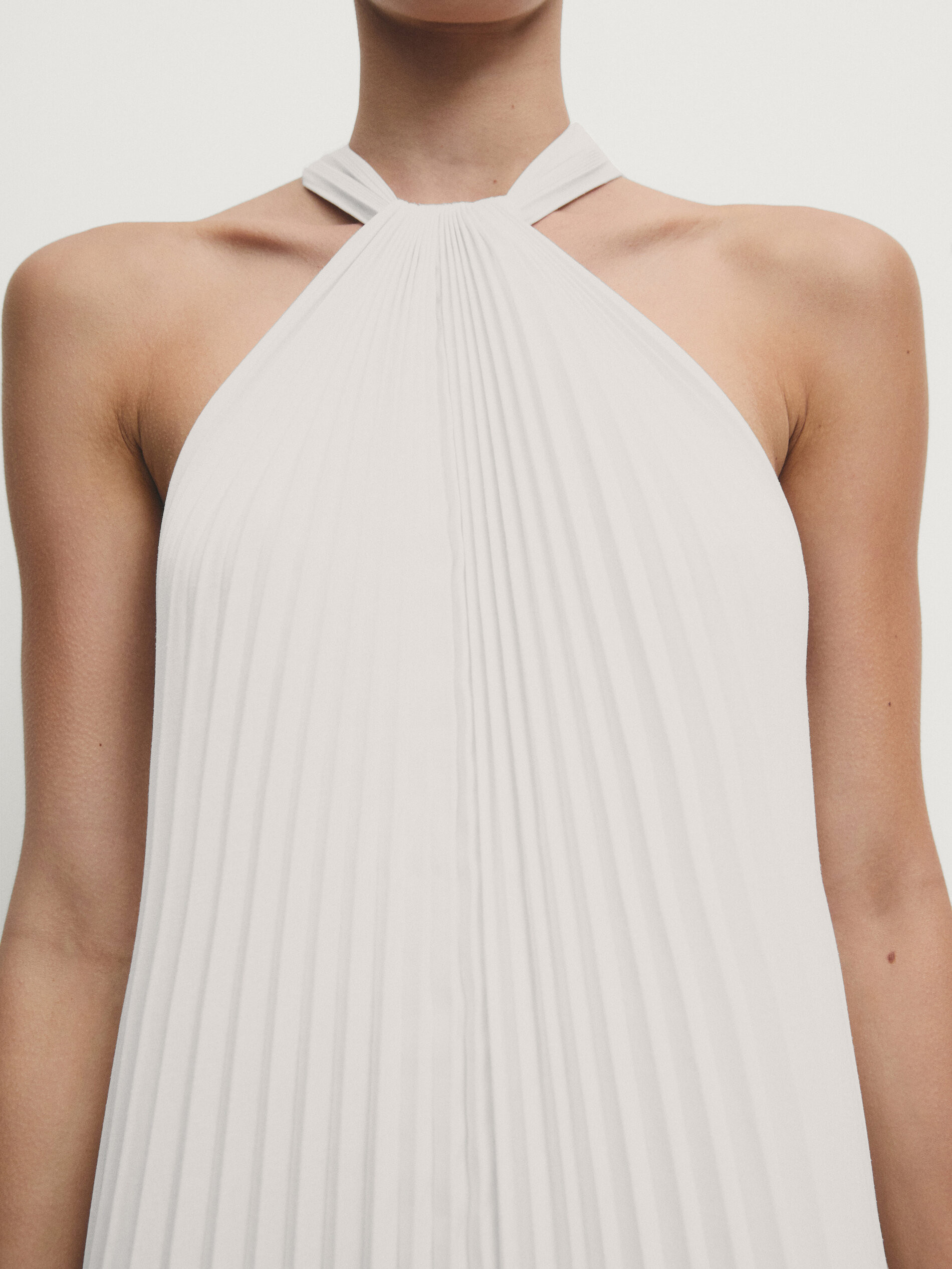 Long pleated halterneck dress | Massimo Dutti US