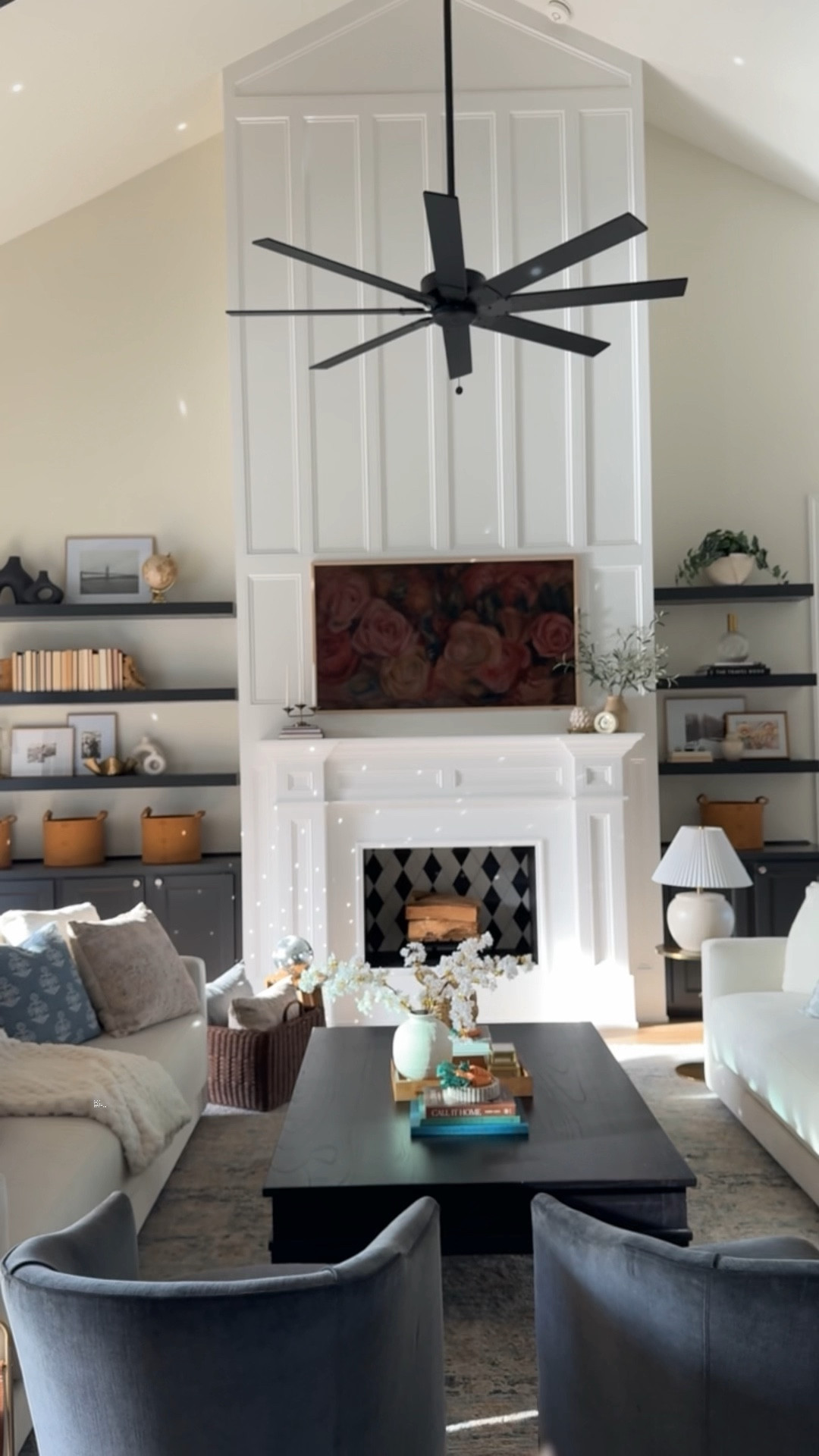 Family room furniture and decor 

- Coffee table is from Arhaus and is no longer available. 
- Fireplace tile is from The Tile Shop

Shelf decor, lamp, couch, sofa, throw pillows, storage basket, faux plant, living room fan, family room rug 

#LTKVideo #LTKhome