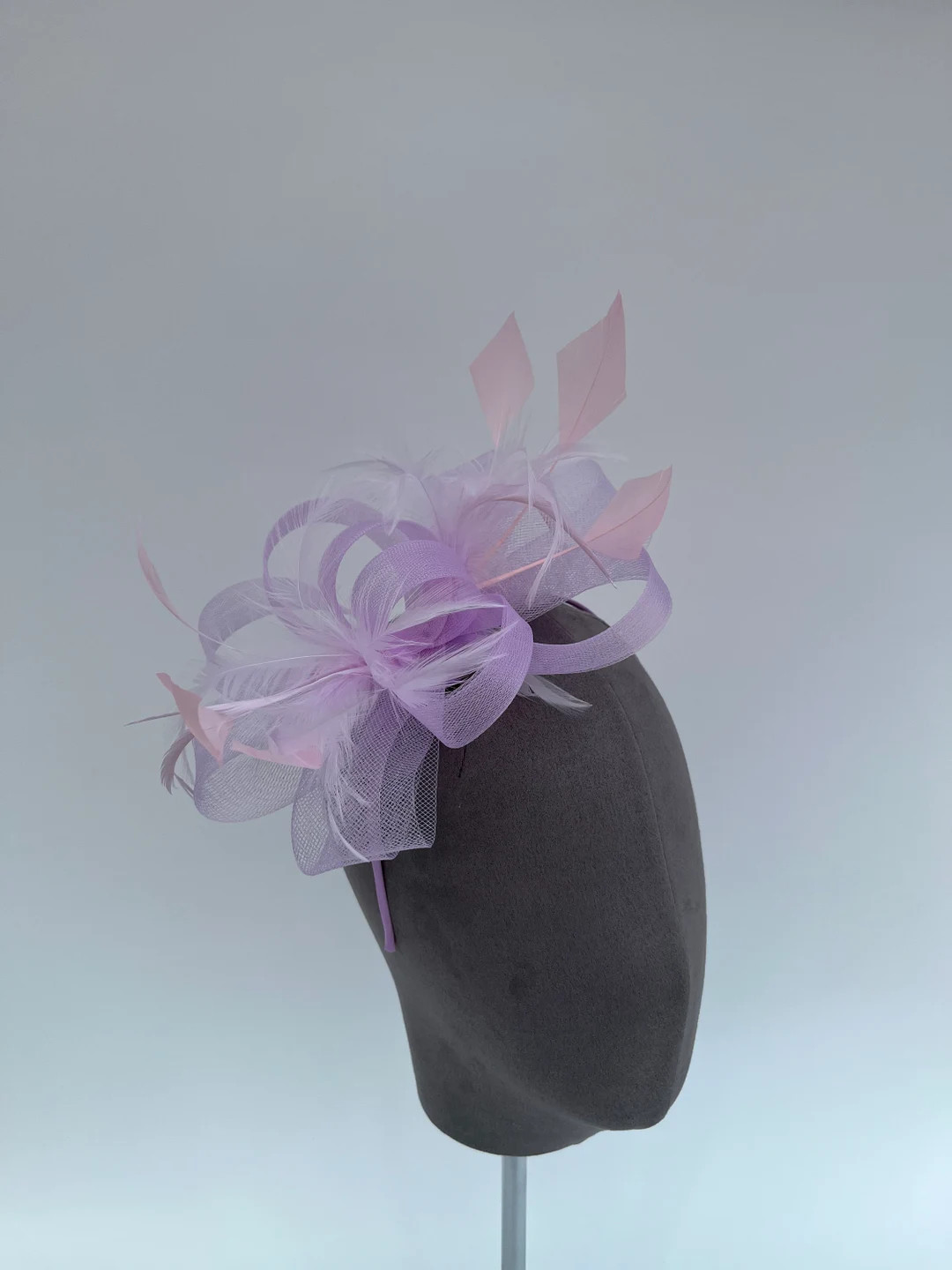 Lilac purple loop bow fascinator with added pastel pink diamond trimmed feathers headband and cli... | Etsy (Global)