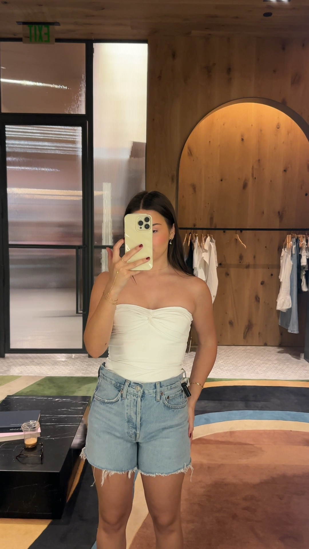 new denim shorts from Agolde and strapless top from Aritzia