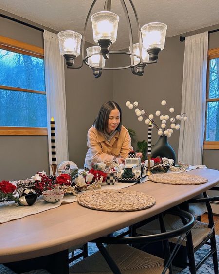 Holiday tablescape idea: classic Christmas colors with a black and white pattern as accent - mostly check pattern with some stripes. Makes a classic but trendy and elevated theme for the holidays! 

#LTKHoliday #LTKhome #LTKSeasonal