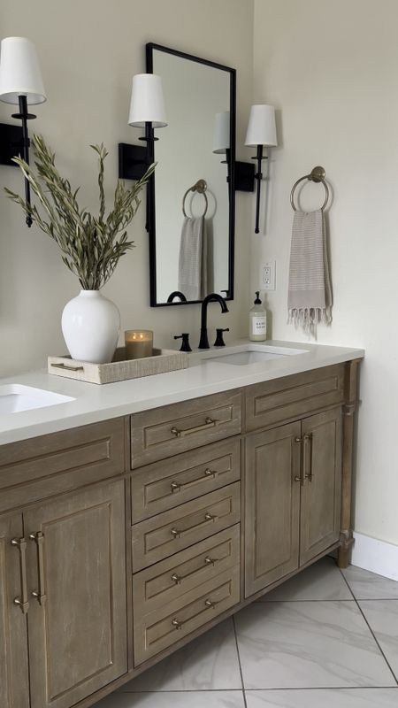 Sale Alert..

Bathroom vanity is 20% off today! It comes with a marble top, we removed that top and used a custom quartz one instead. Also replaced the hardware. 

Bathroom, bathroom vanity, bathroom decor, bathroom lighting, sconce, shaded sconce, black sconce, wall mirror, black mirror, bathroom mirror, towel ring, hand towel, towels, soap dispenser, home decor, table decor, shelf decor, Amazon, Amazon home, Amazon finds 

#LTKhome #LTKFind #LTKsalealert