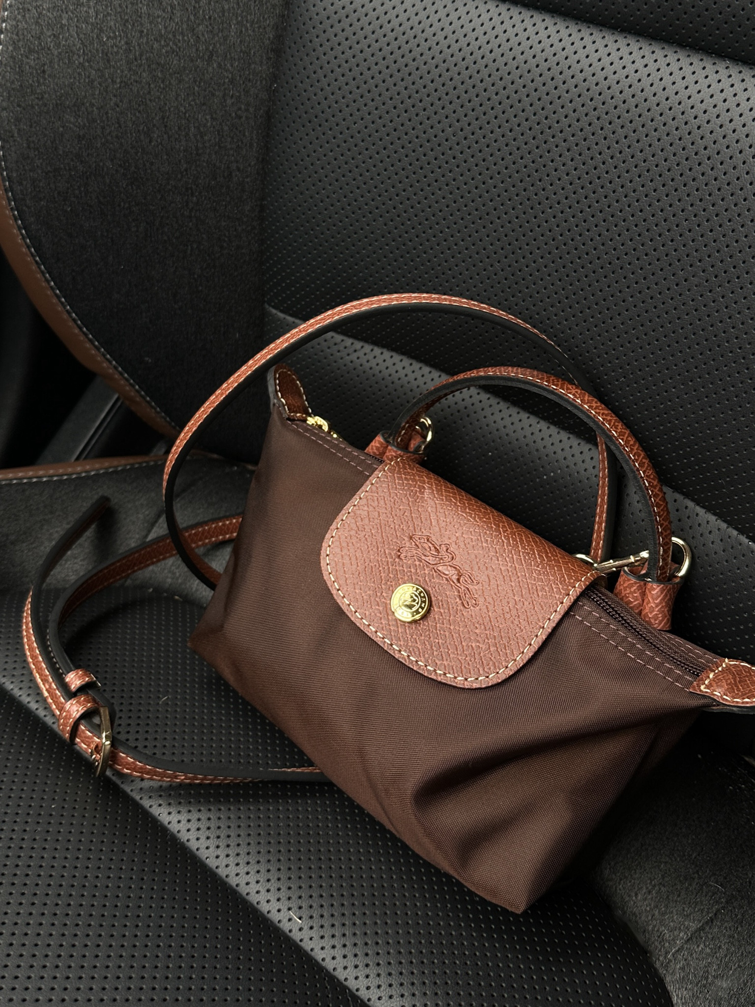 longchamp pouch as a crossbody bag! straps are on sale for cyber monday, 
perfect gift for the holidays or fall/winter accessory 🤎

#LTKCyberWeek #LTKHoliday #LTKGiftGuide
