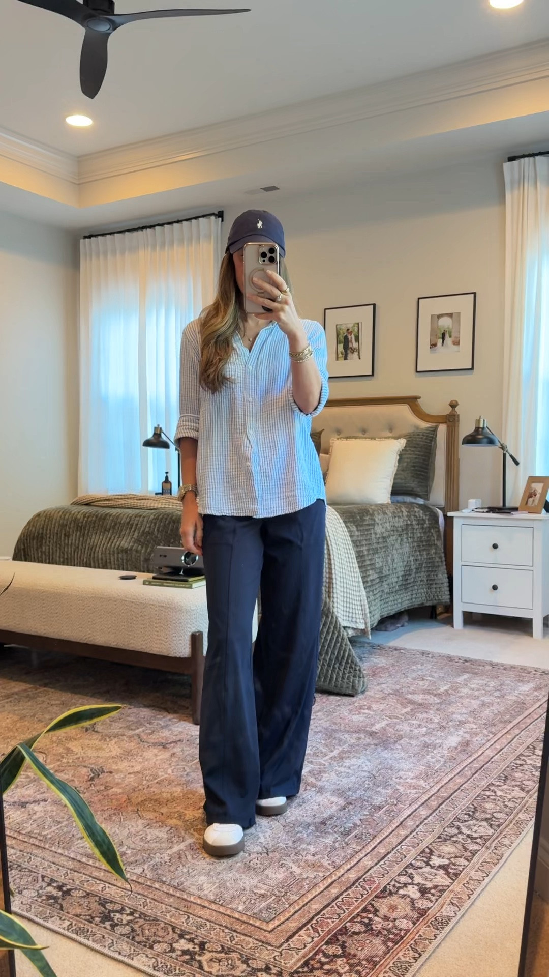 My favorite kind of outfit: comfortable enough for real life but polished enough to feel put together.

A striped button-down, navy athletic trousers, sneakers, and a baseball cap somehow manage to feel equal parts coastal, sporty, and elevated.

This is the outfit formula I reach for when I want to look intentional without trying too hard.

Sizing:
• Quince striped button-down: Small
• Athletic trousers: XS
• Adidas sneakers: true to size

Use my Quince code INFG-26LINENANDLIGHTCO10 for 10% off your first order 🤍

#LTKootd #LTKmomlife #LTKSeasonal

#LTKootd #LTKSeasonal #LTKWorkwear