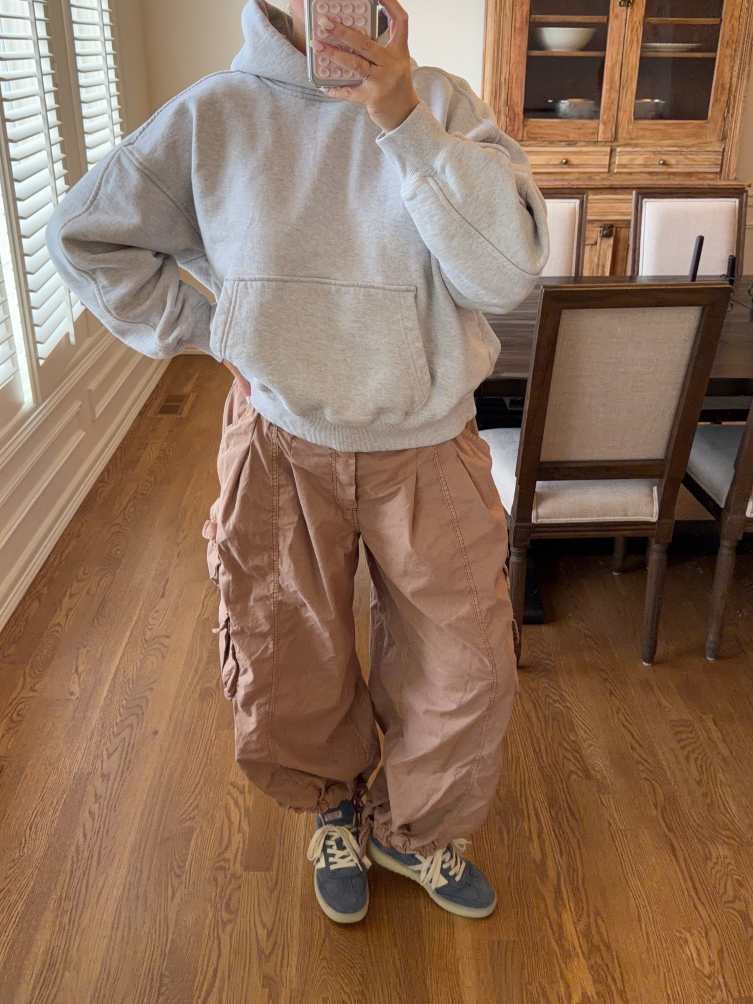 Free people movement sweatshirt runs big I’m wearing a small! Size medium in cargo pants. Linked similar shoes 