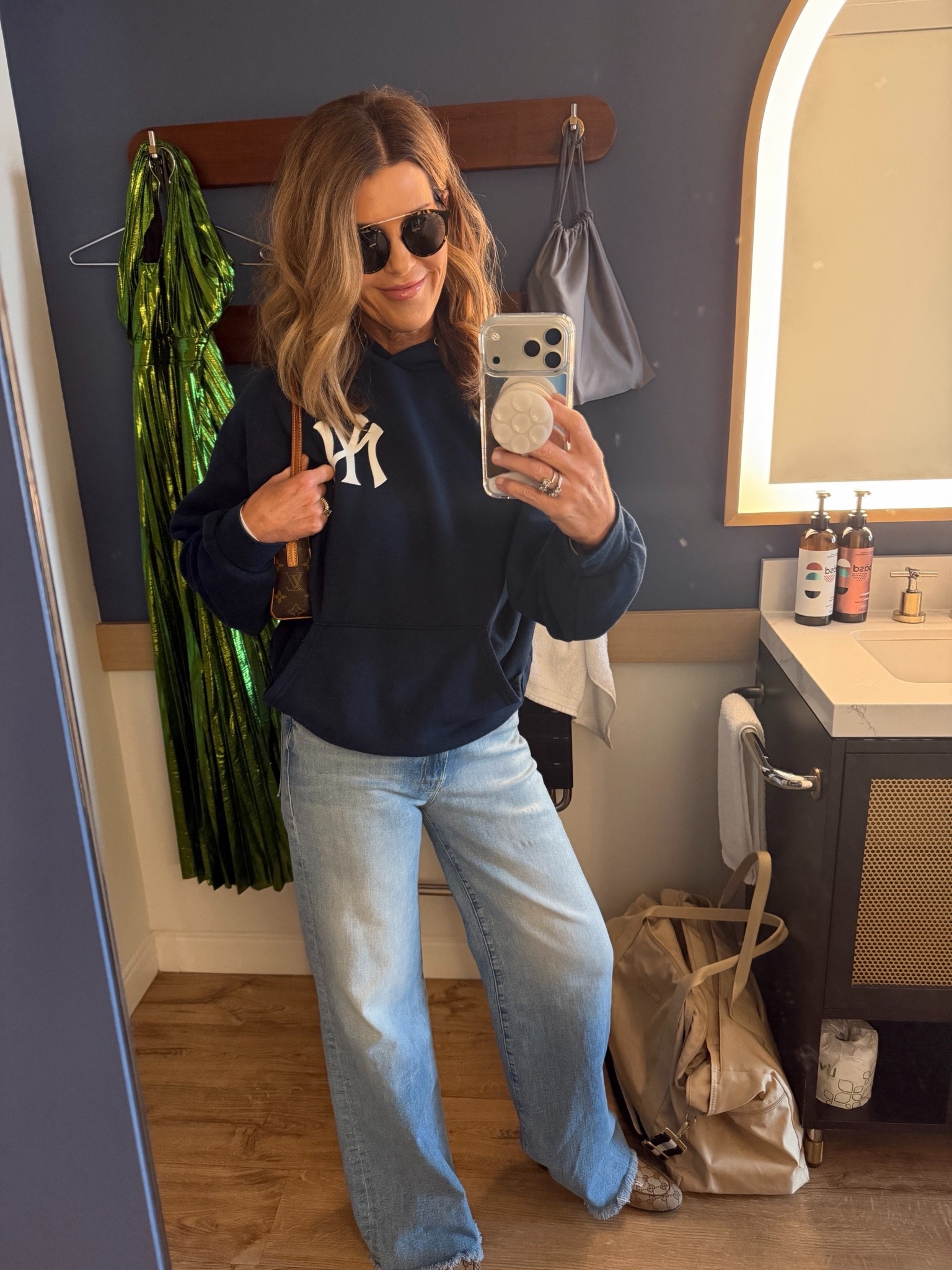 Wearing a size medium in Aviator Nation Yankees pullover
What I wore to Yankees game

#LTKOver40