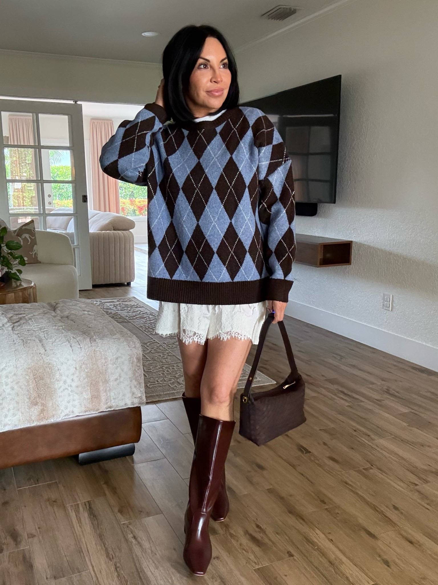 This sweater is so cozy and perfect for fall. I have paired it with lace shorts, but you can really style it any way you want. The burgundy boots adds so much flare.